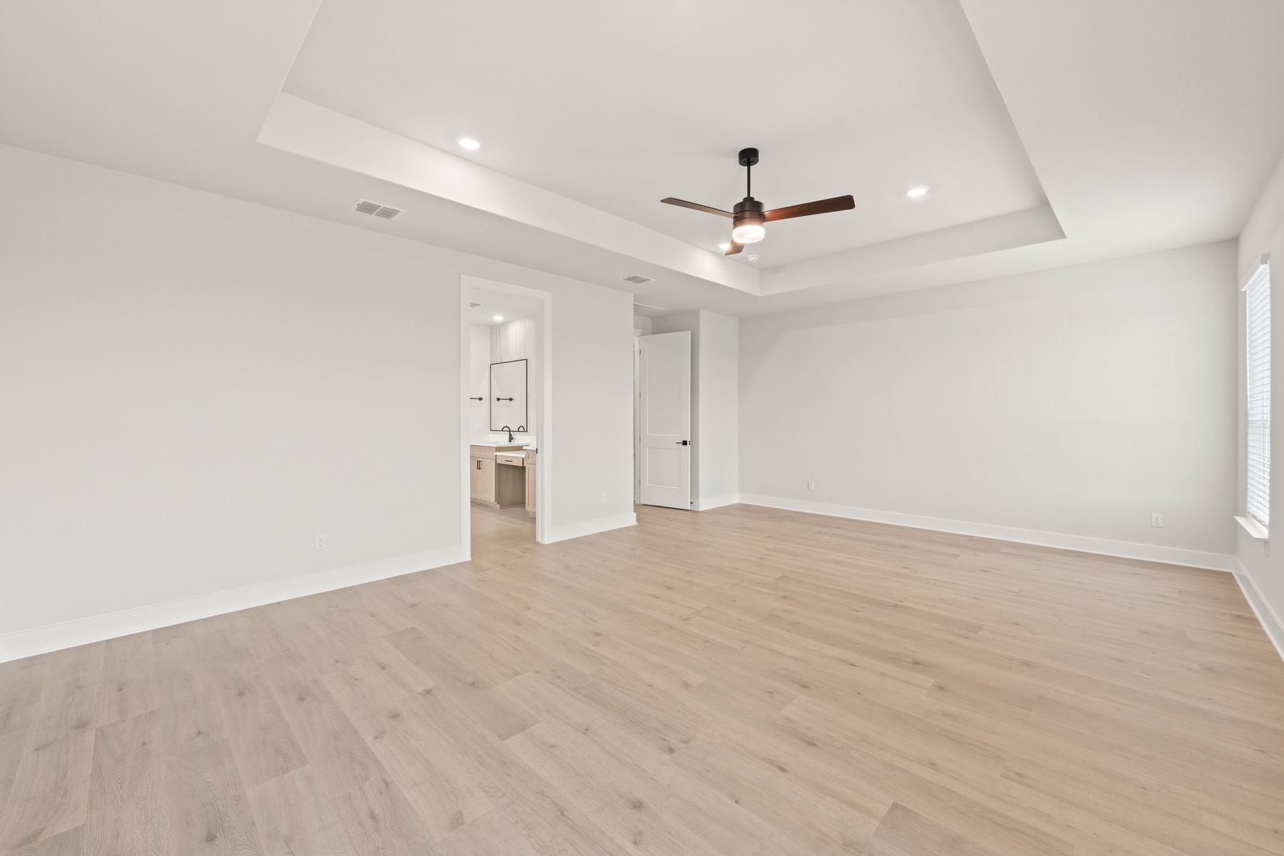 The master suite has a large bedroom, ensuite bathroom and a walk-in closet.