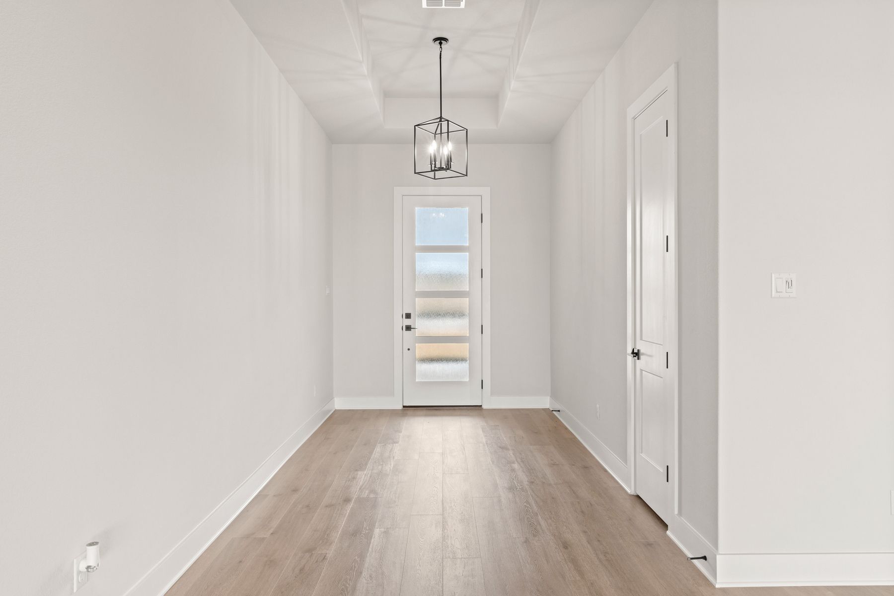 The foyer welcomes residents and guests into this beautiful home.