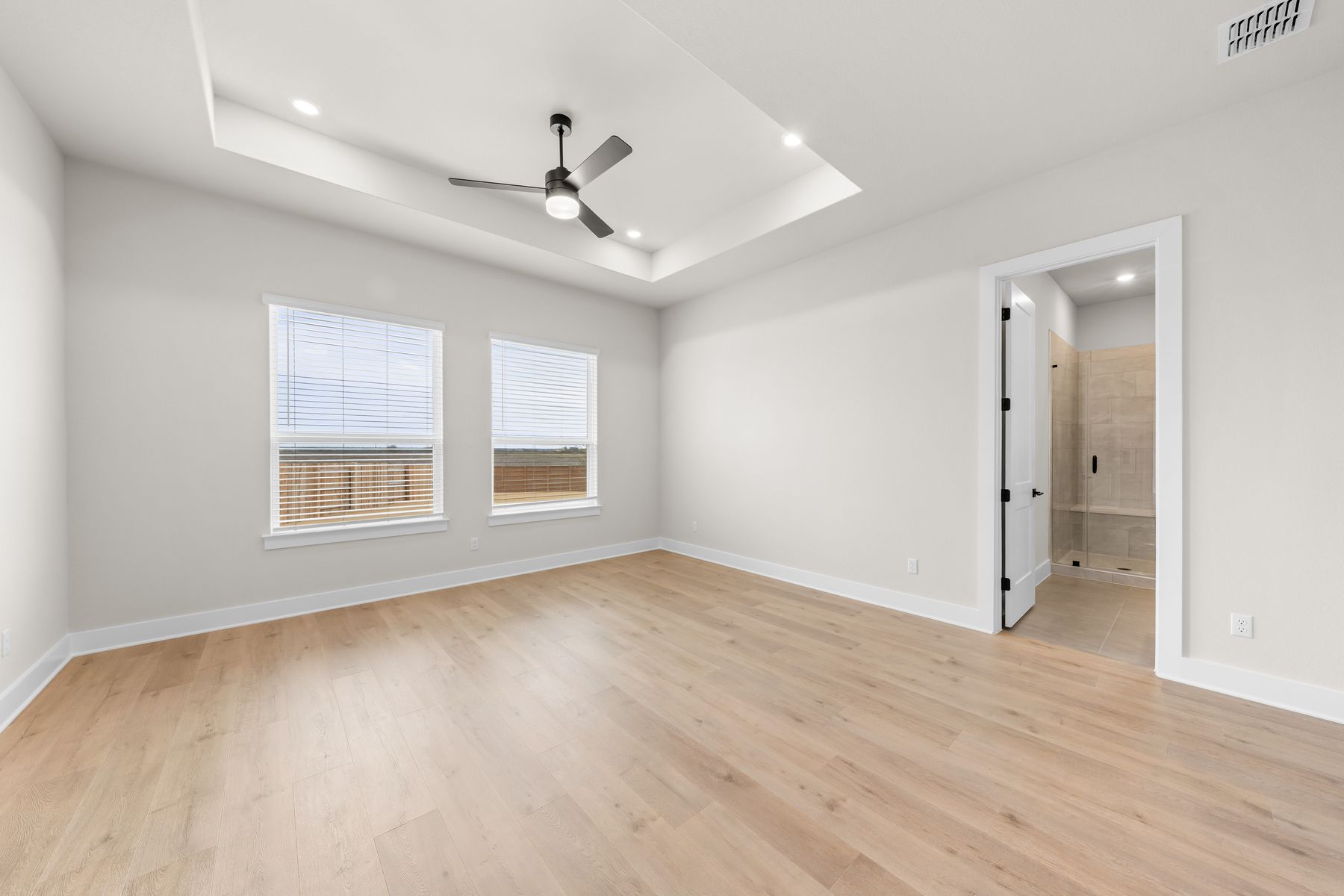 The master suite has a large bedroom, ensuite bathroom, and walk-in closet.