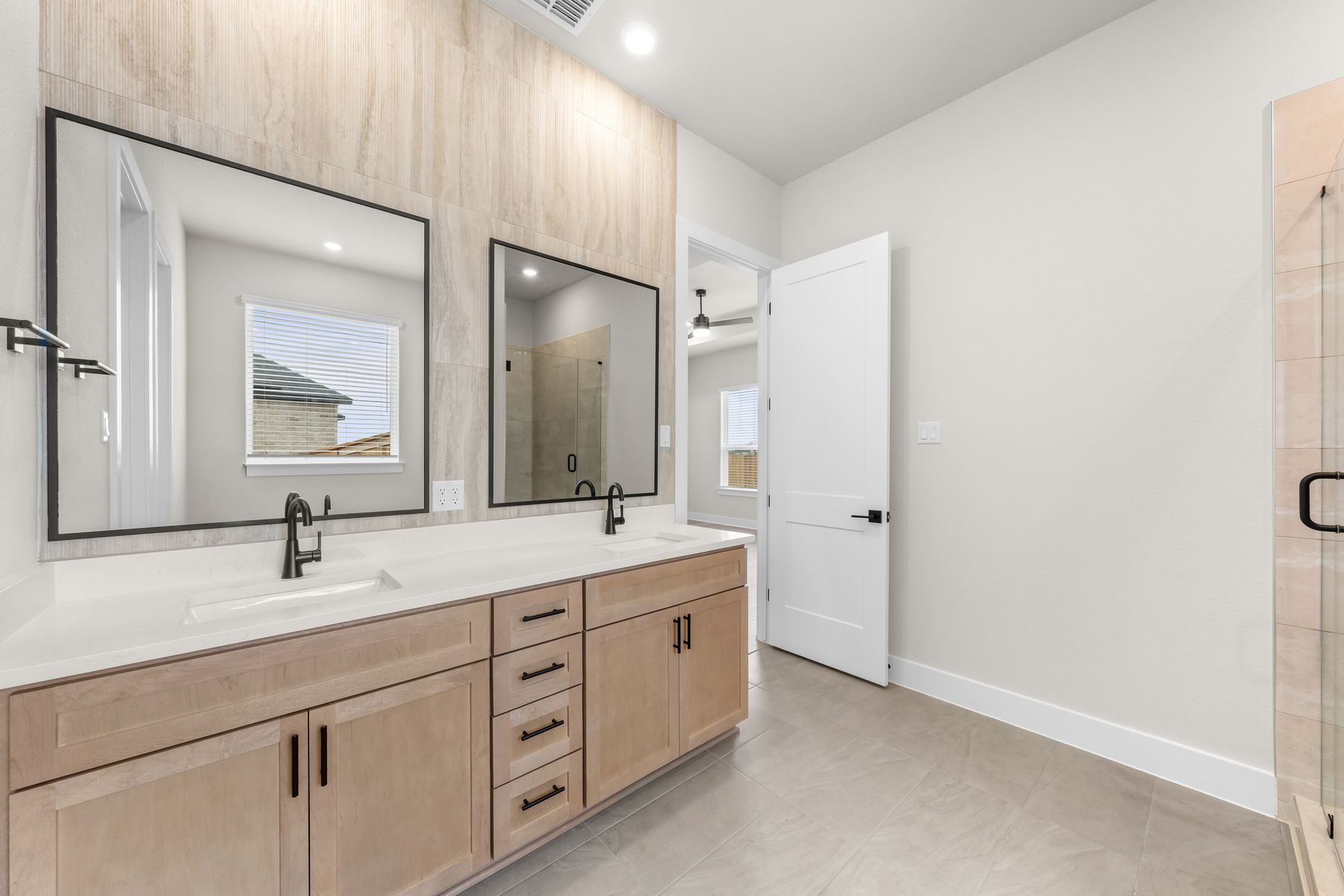 The master bathroom has a sprawling dual-sink vanity.