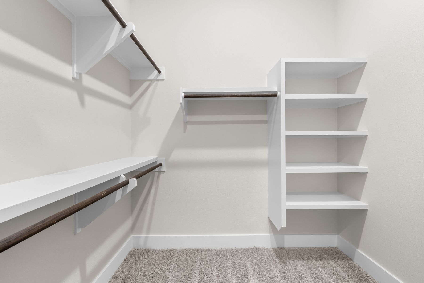 The walk-in, master closet has plenty of hanging and shelf space.