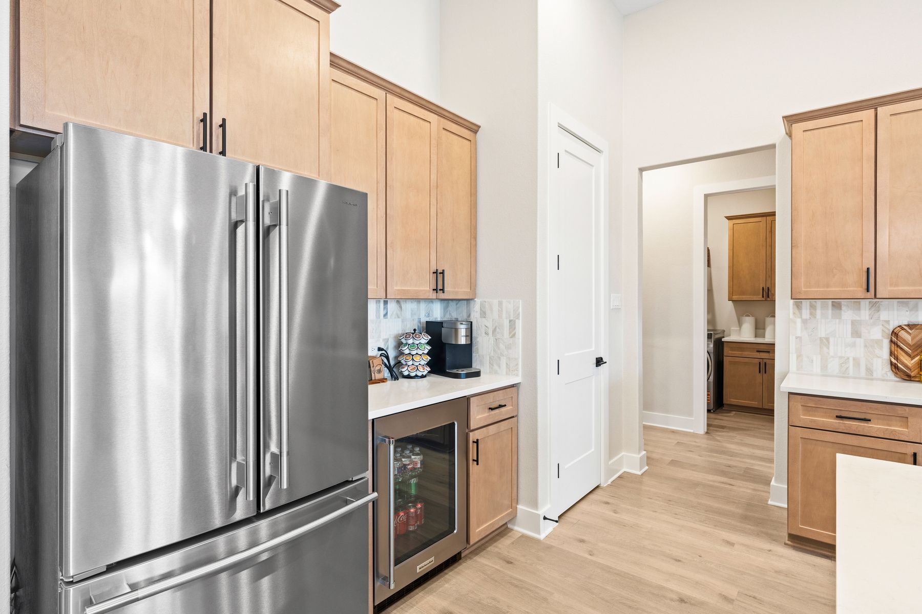 The kitchen has a double door refridgerator with a freezer drawer.