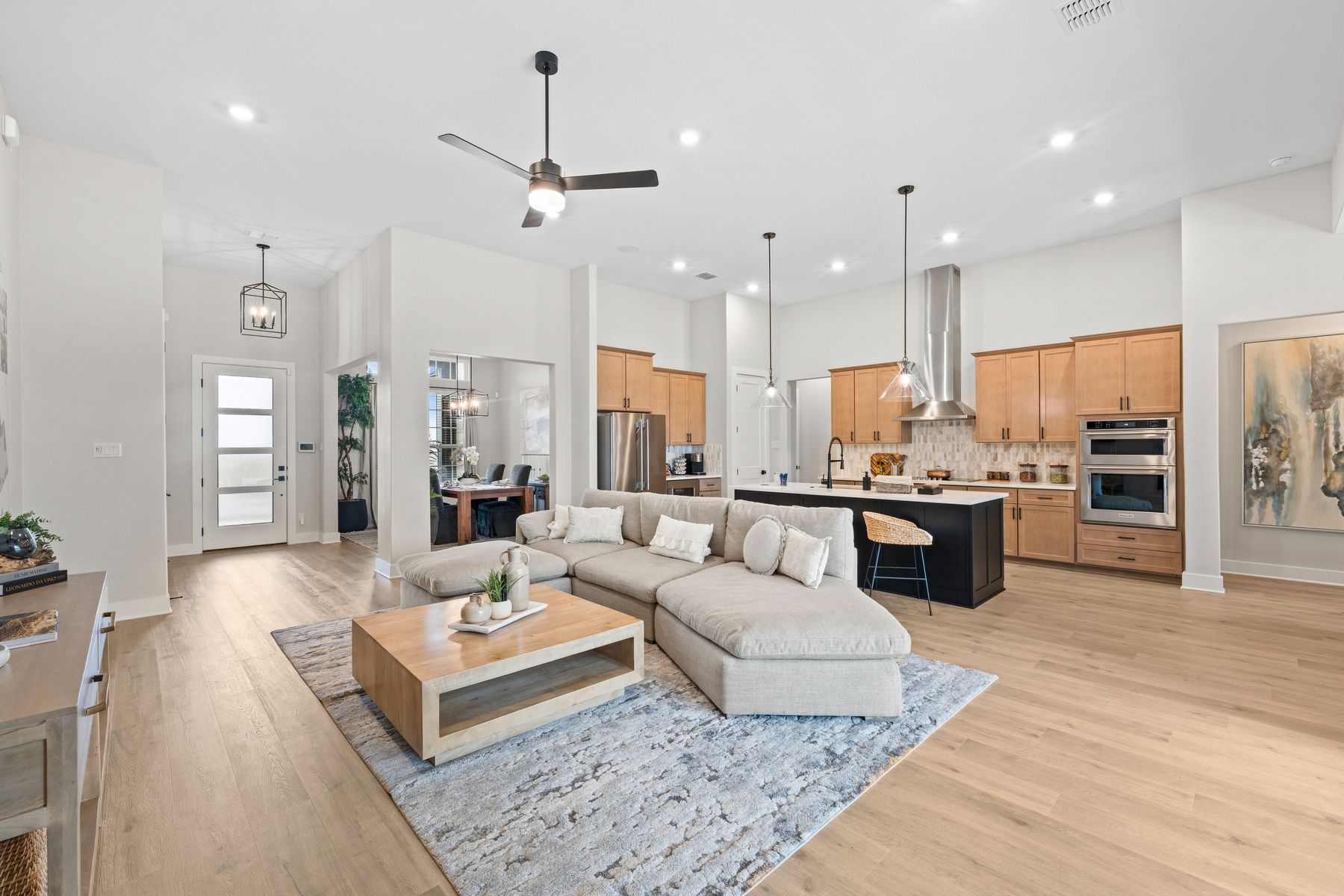The open layout connects the kitchen, breakfast nook. dining room and family room.