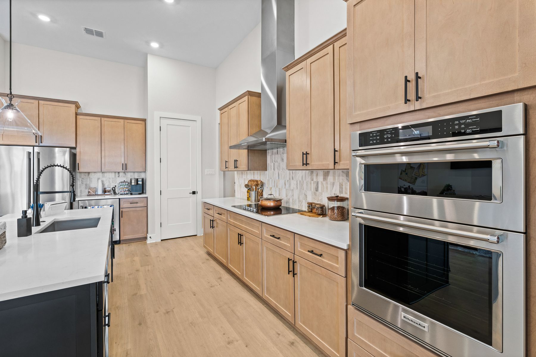 The kitchen has sprawling granite countertops.
