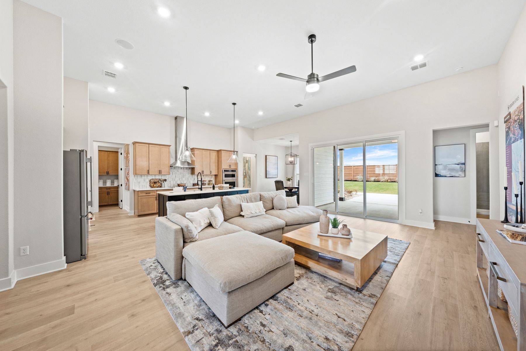 The open layout connects the kitchen, breakfast nook. dining room and family room.