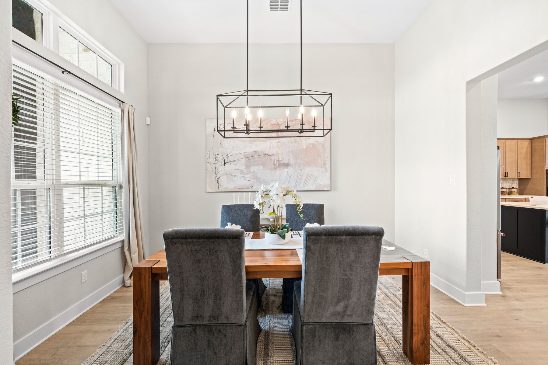 The formal dining room has a large window that lets in great, natural light.