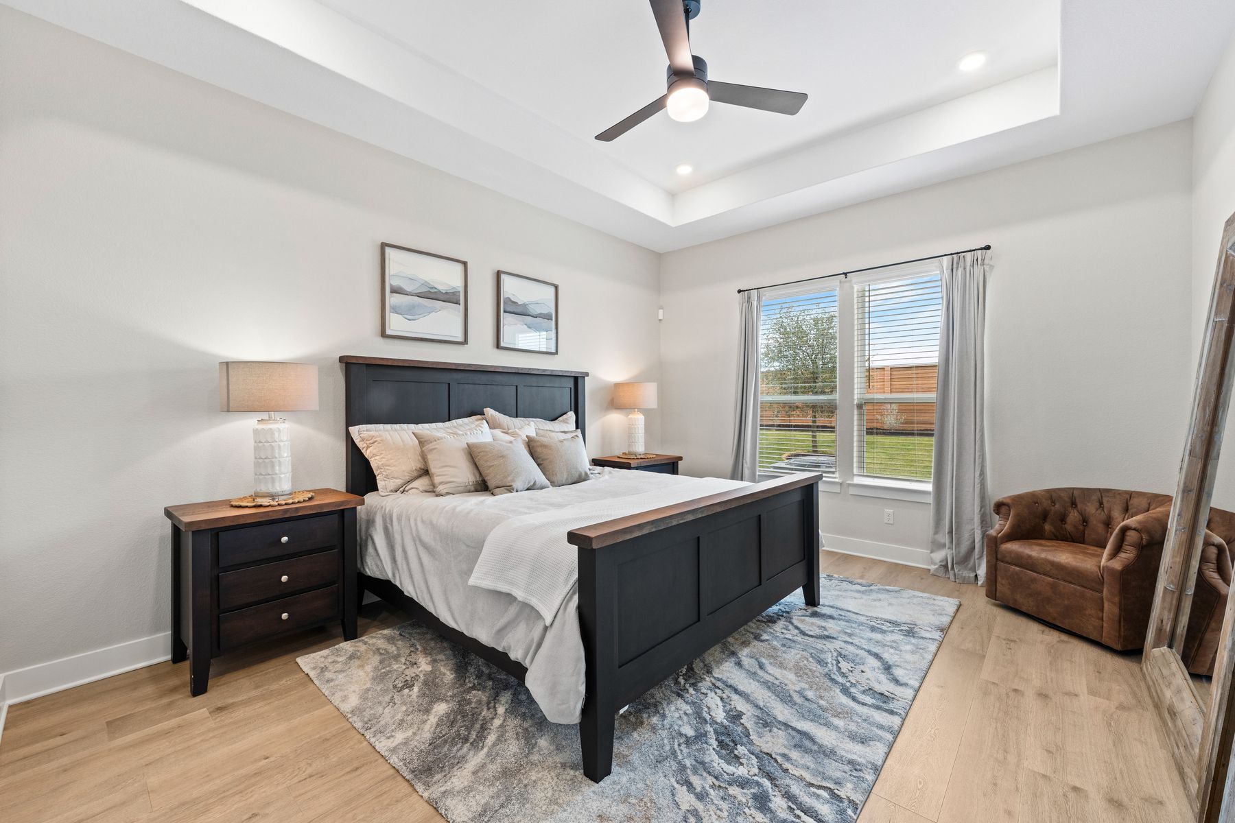 The master bedroom has a large window that lets in great, natural light and backyard views.