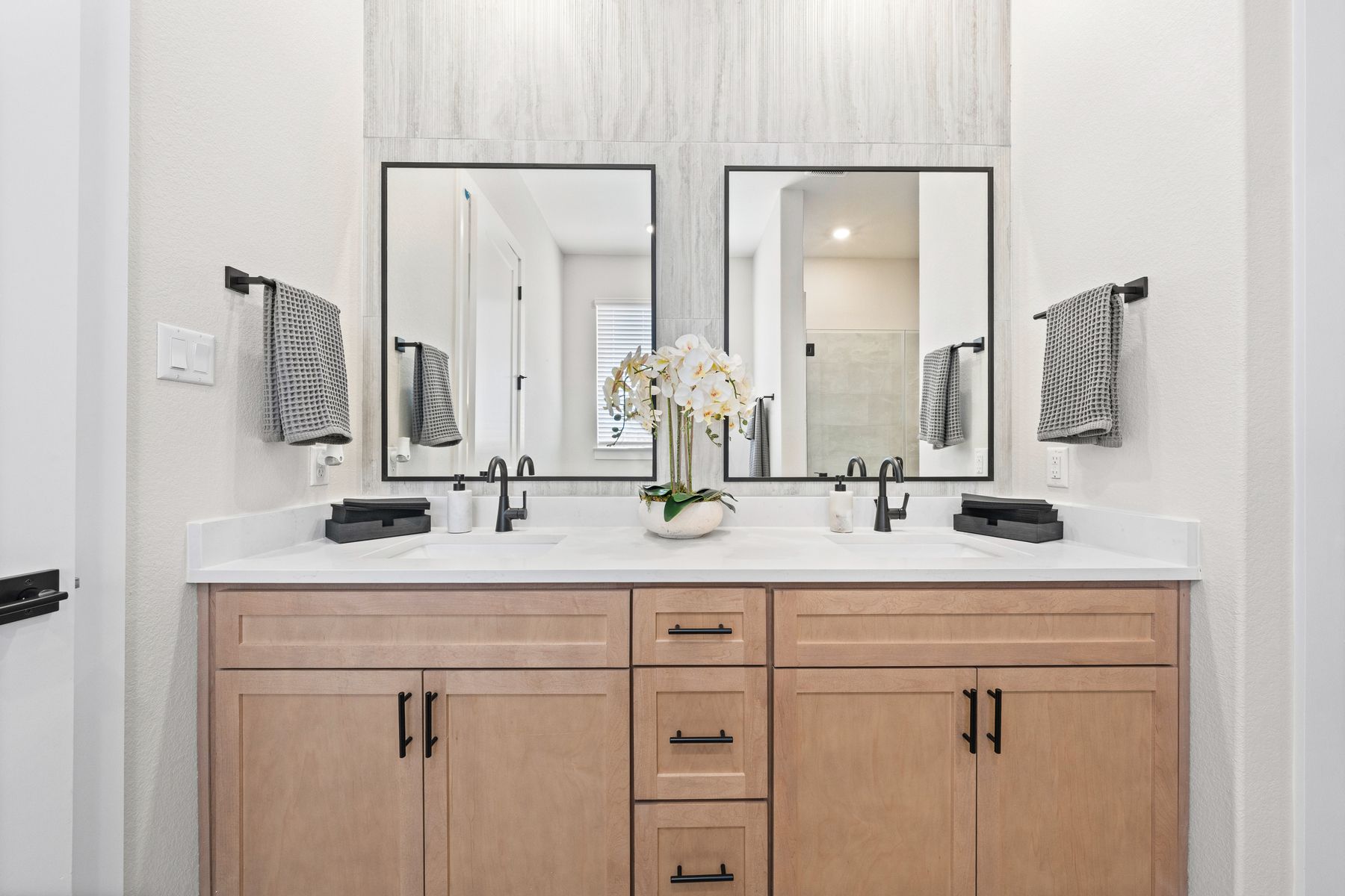 The master bathroom has a sprawling dual-sink vanity.