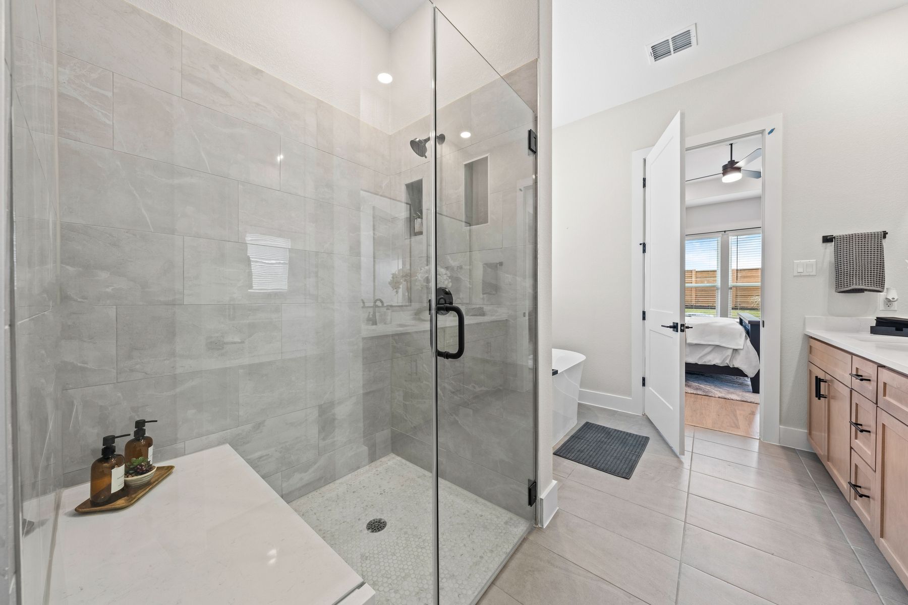 The master bathroom has a glass, walk-in shower.