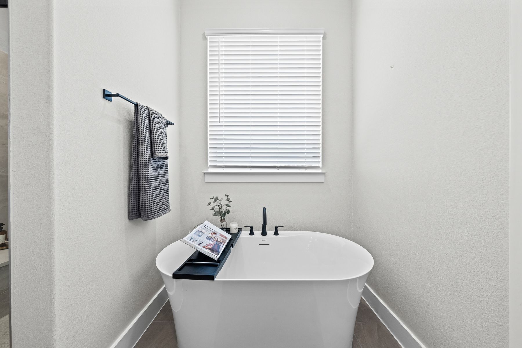 The master bathroom has a glass, walk-in shower. The master bathroom has a garden tub.