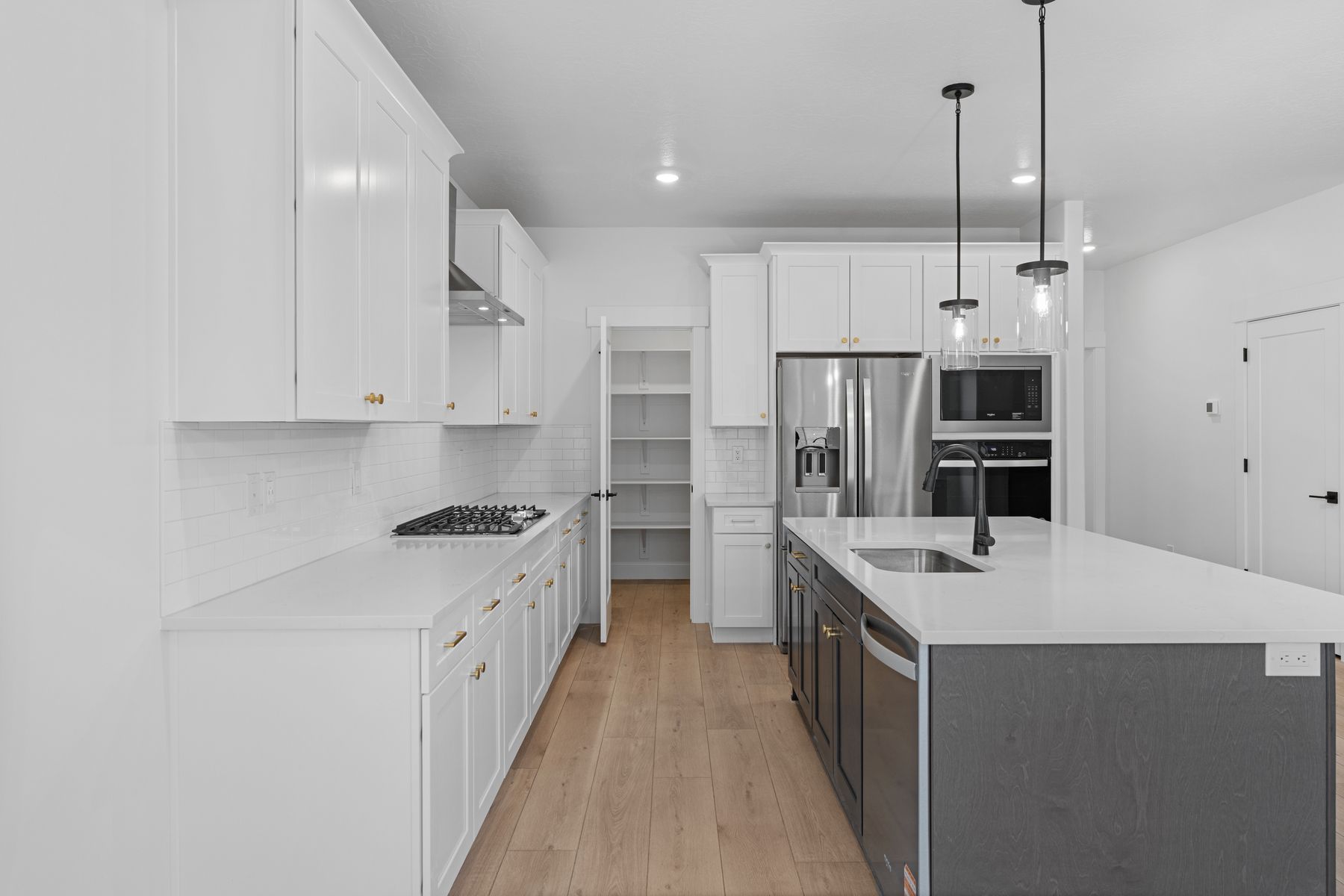 The kitchen has an extended pantry.
