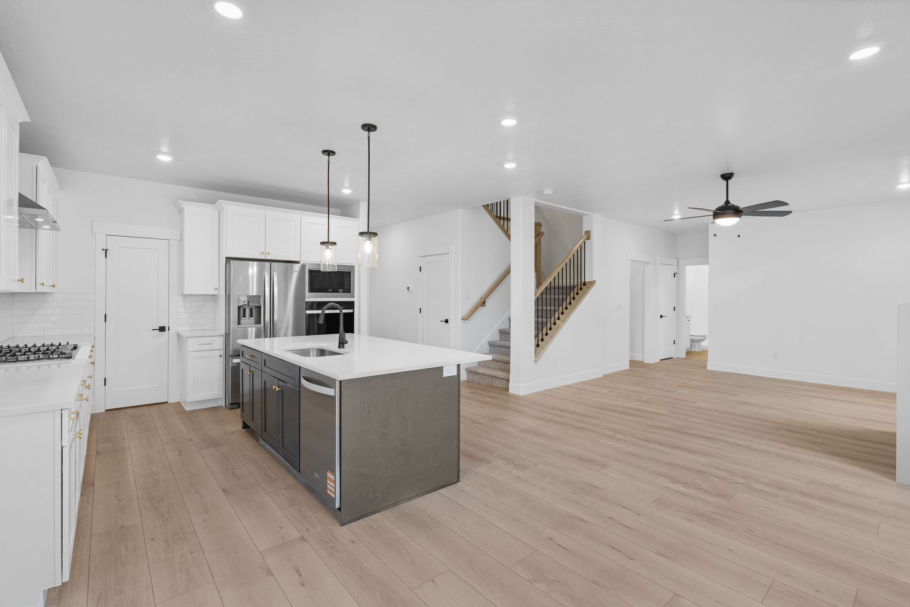 The open-concept layout connects the kitchen, dining room and family room.
