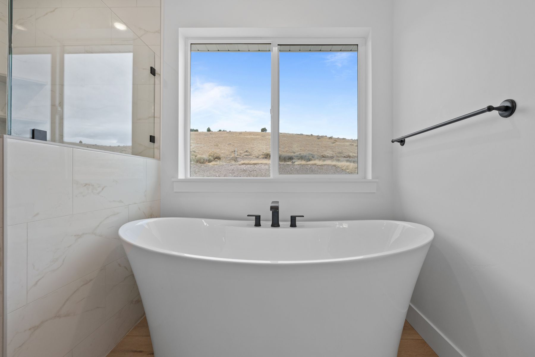 The master bathroom has a stand-alone soaker tub.