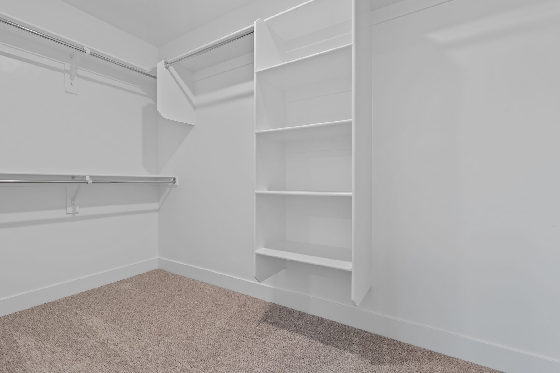 The walk-in, master closet has lots of storage space.