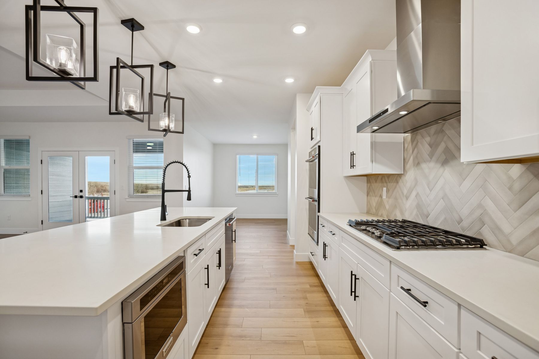 The kitchen has gorgeous white cabinetry.