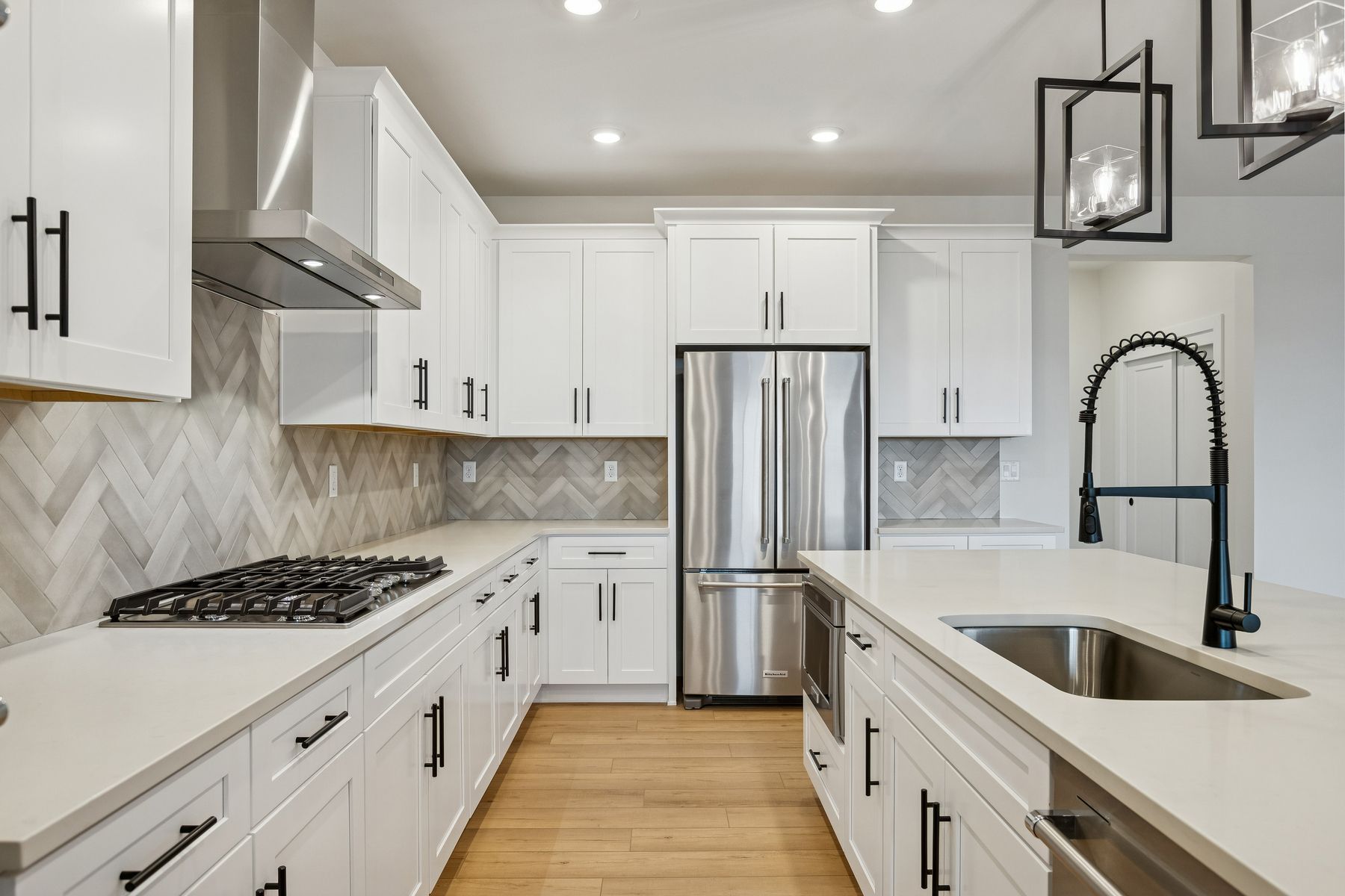 The kitchen has stainless-steel, KitchenAid appliances.