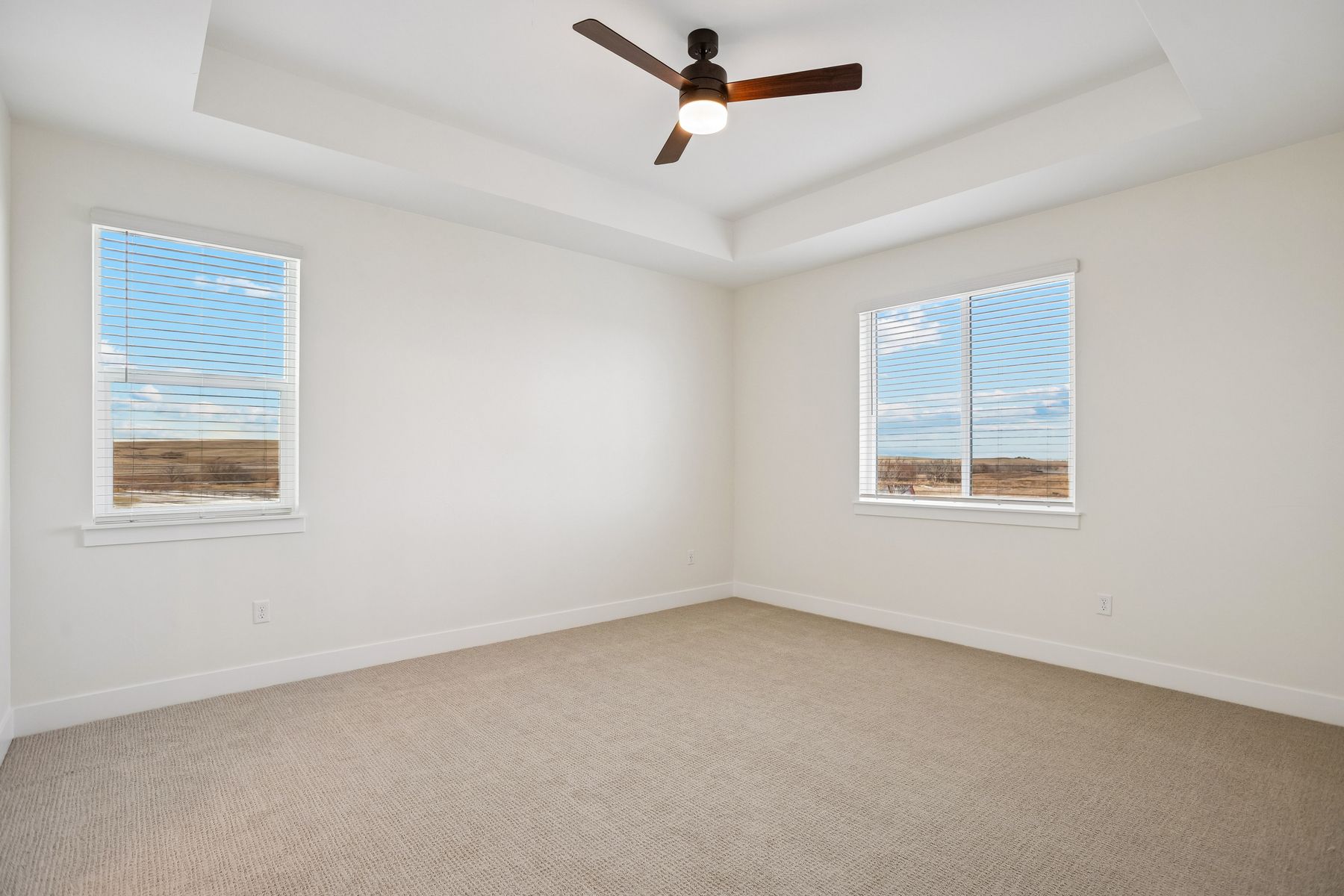 The master bedroom has large windows that let in great, natural light.