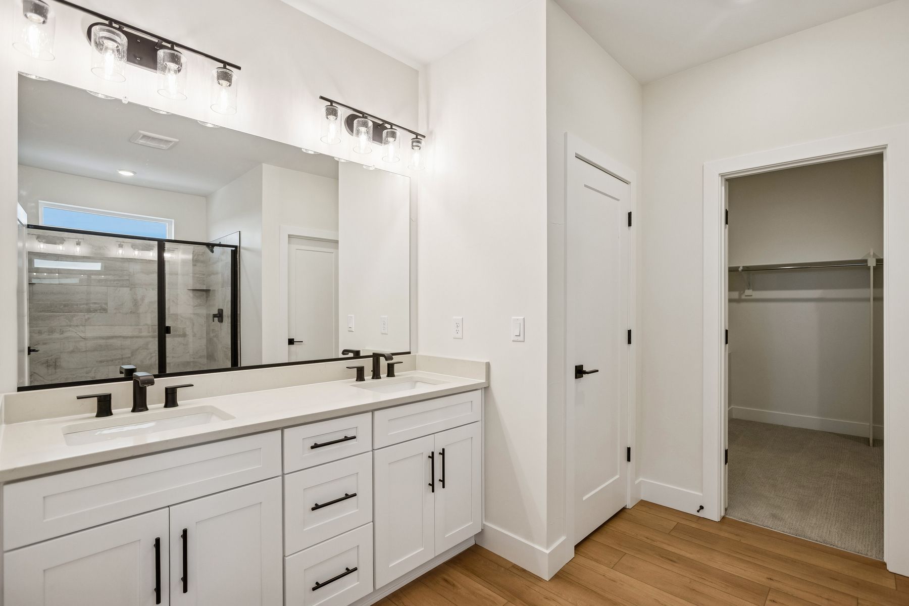 The master bathroom has a beautiful dual-sink vanity.