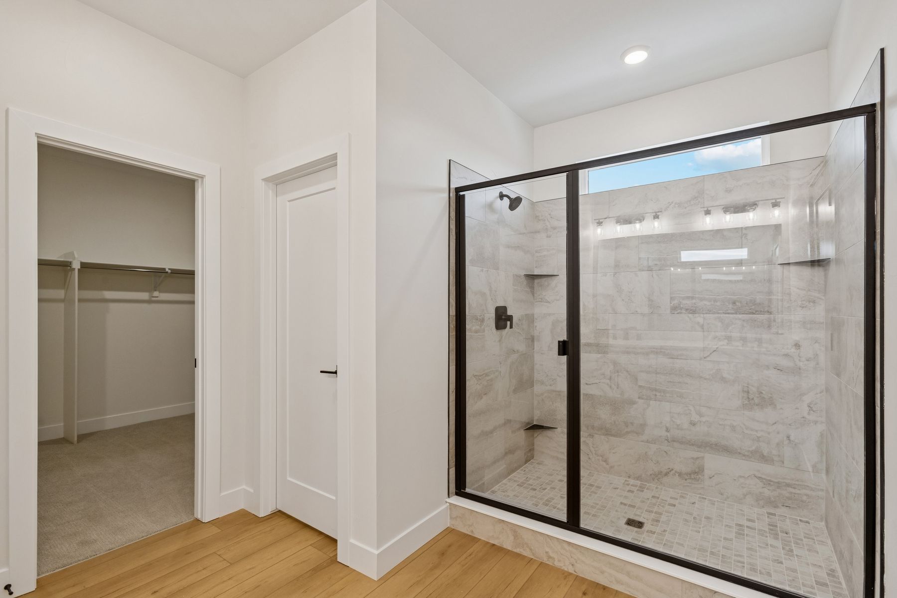 The master bathroom has a gorgeous, tiled walk-in shower.