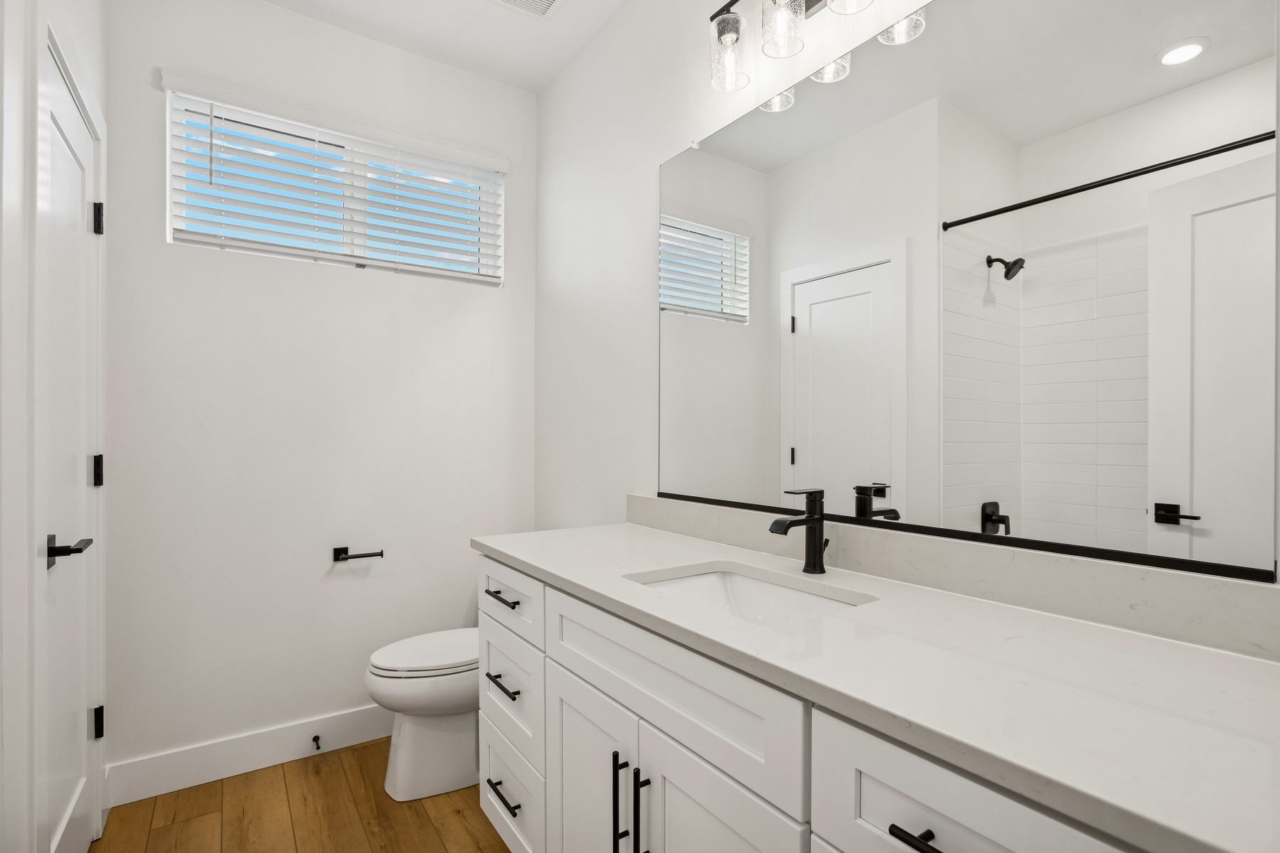 The secondary bathroom has a sprawling vanity with lots of counterspace.