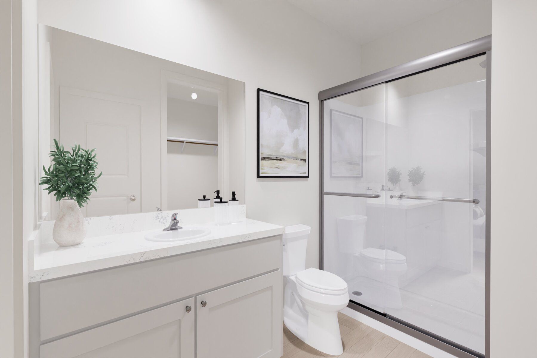 The master bathroom has a large vanity and a step in shower.