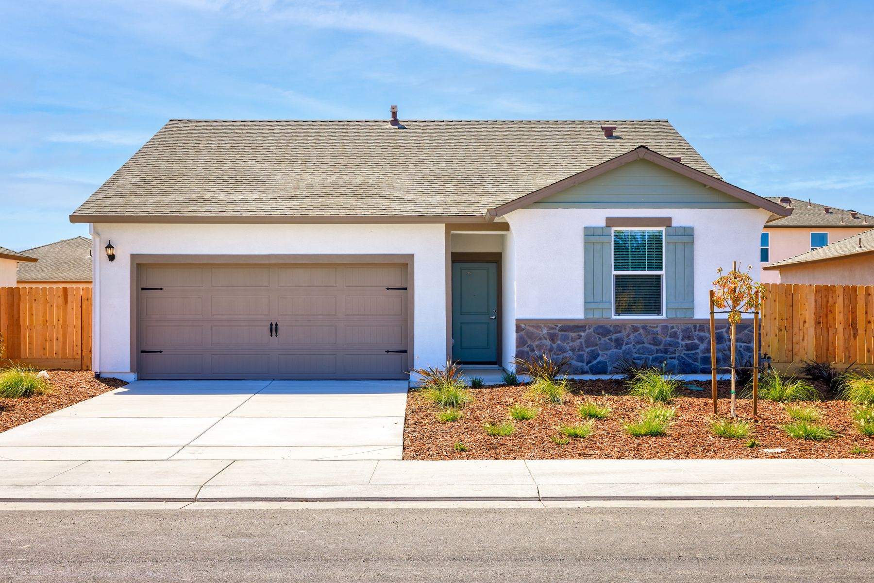 The Baker is a beautiful home with stone and stucco.