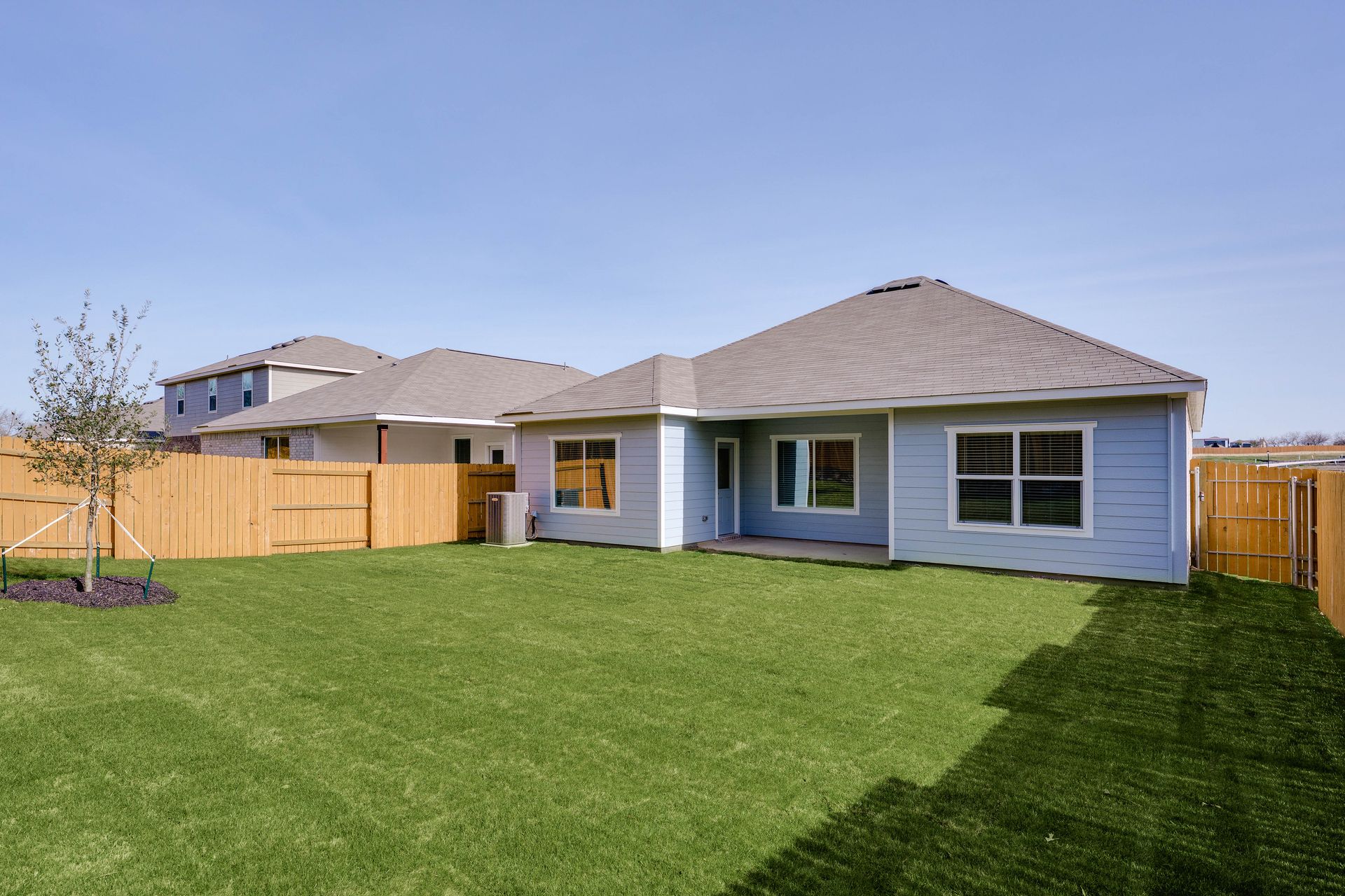 The back yard is fully fenced in.