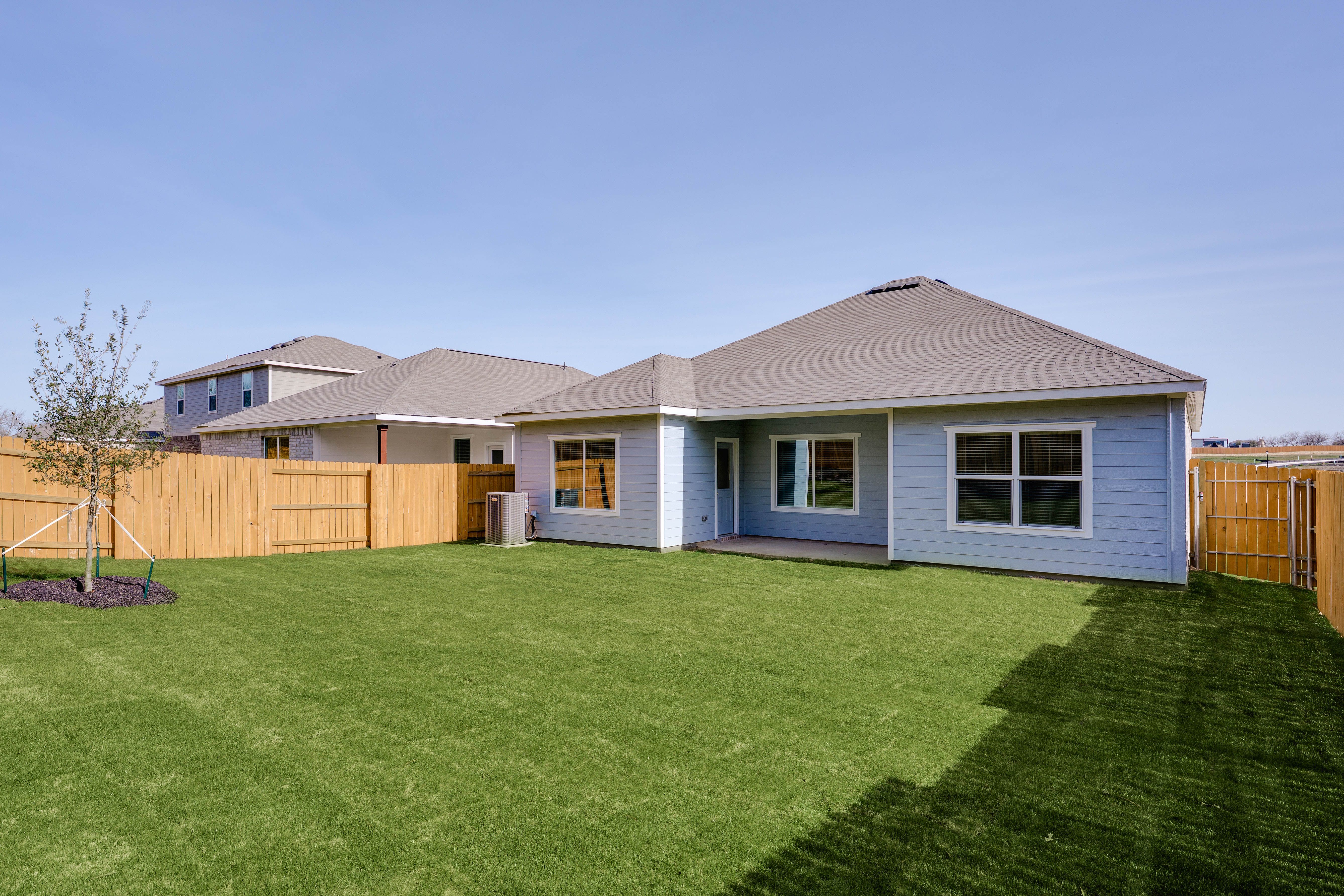 The back yard is fully fenced in.