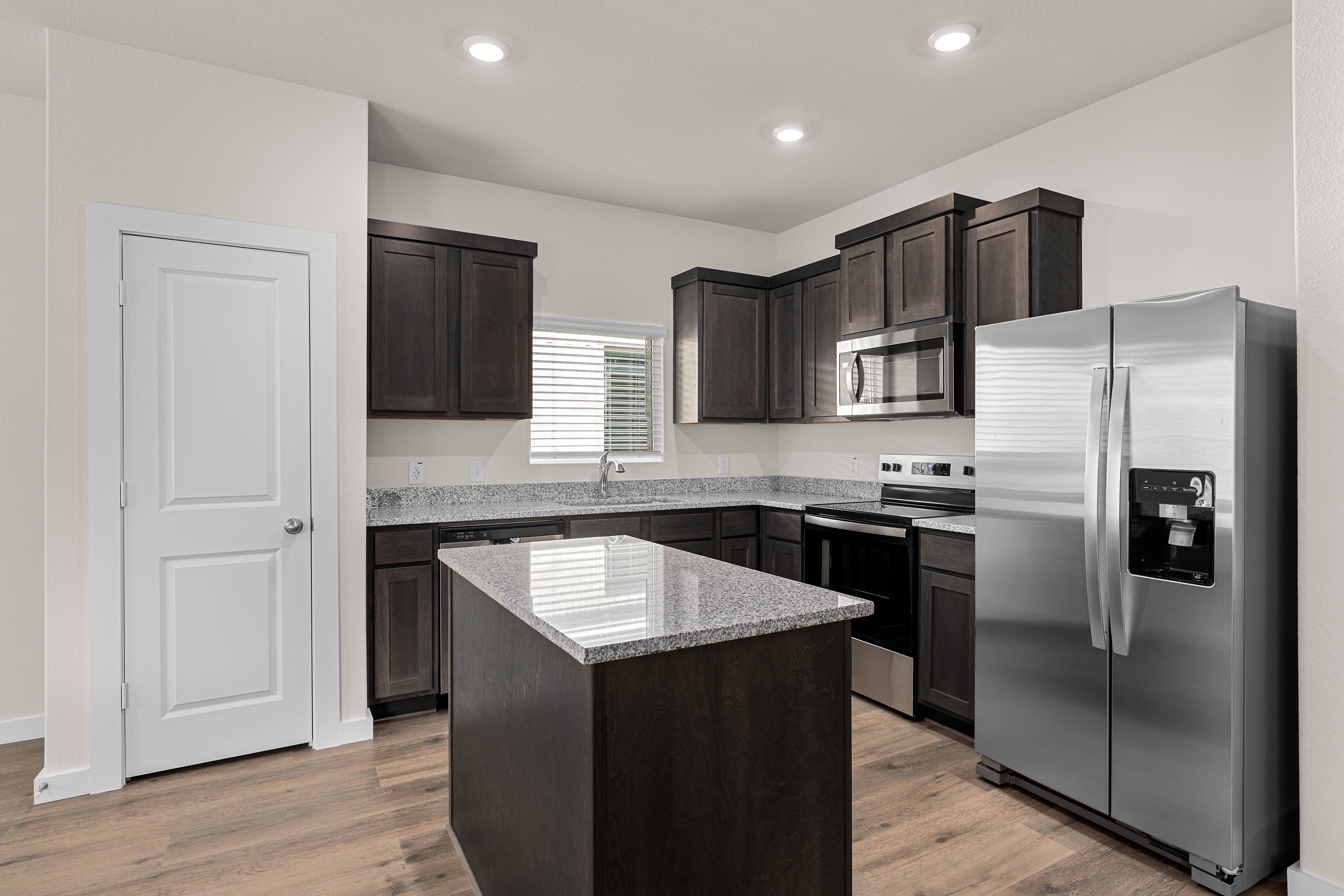 The kitchen has stainless-steel, energy-efficient appliances.