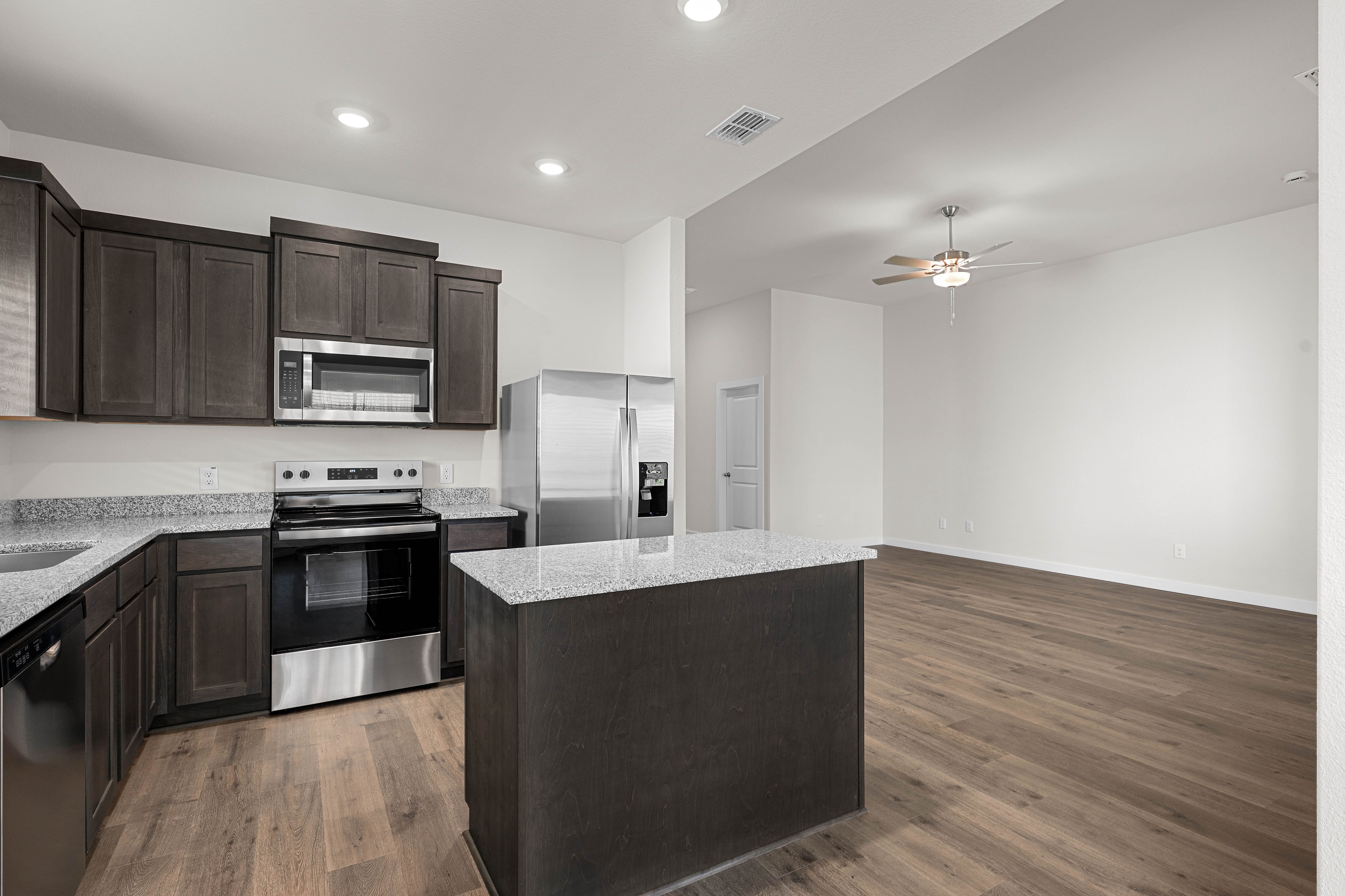 The kitchen has beautiful wood cabinetry.