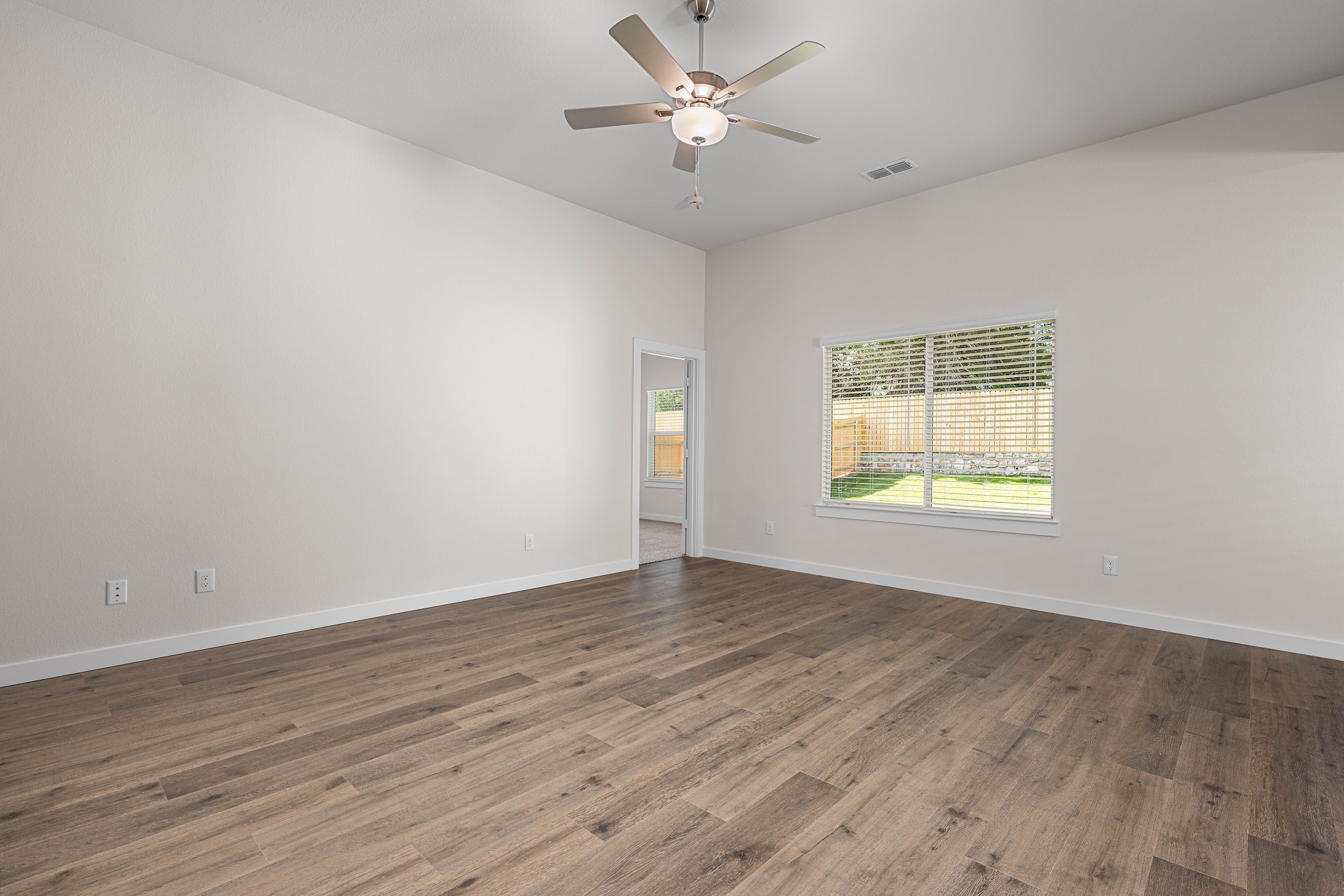 The living room has a large window that lets in great, natural light.
