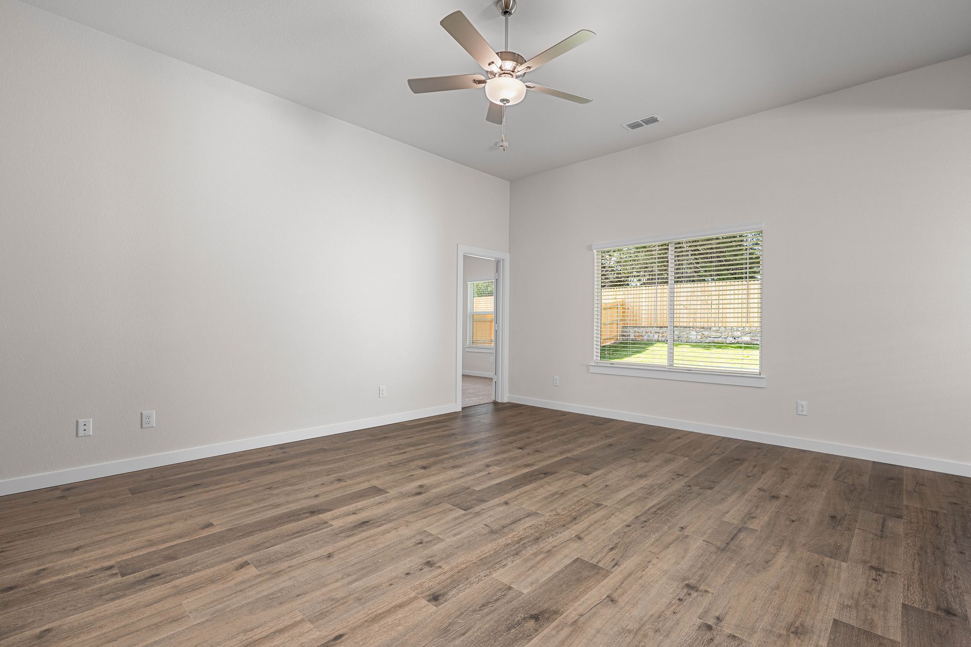 The living room has a large window that lets in great, natural light.