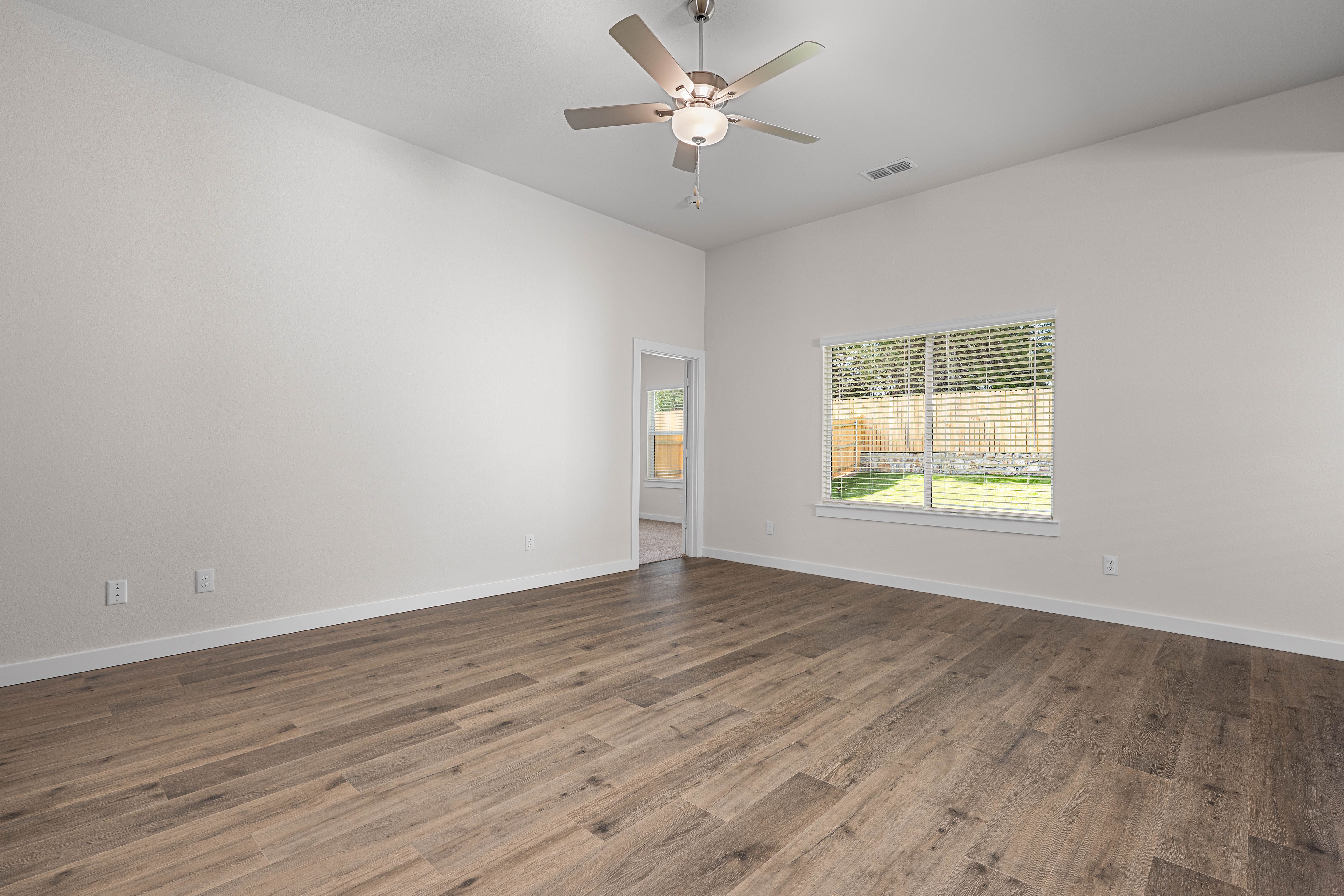 The living room has a large window that lets in great, natural light.
