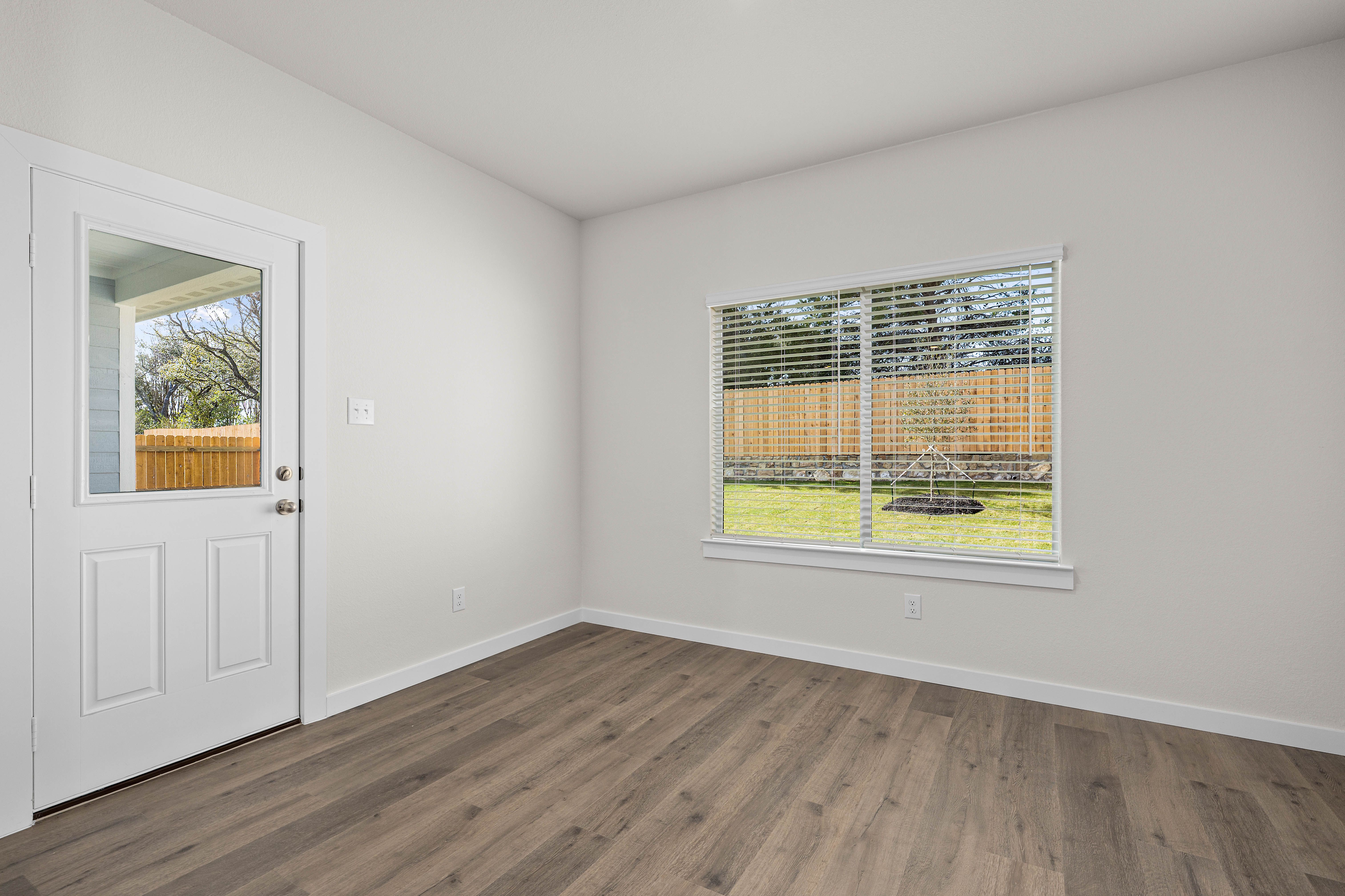The dining room has large windows that let in great, natural light.