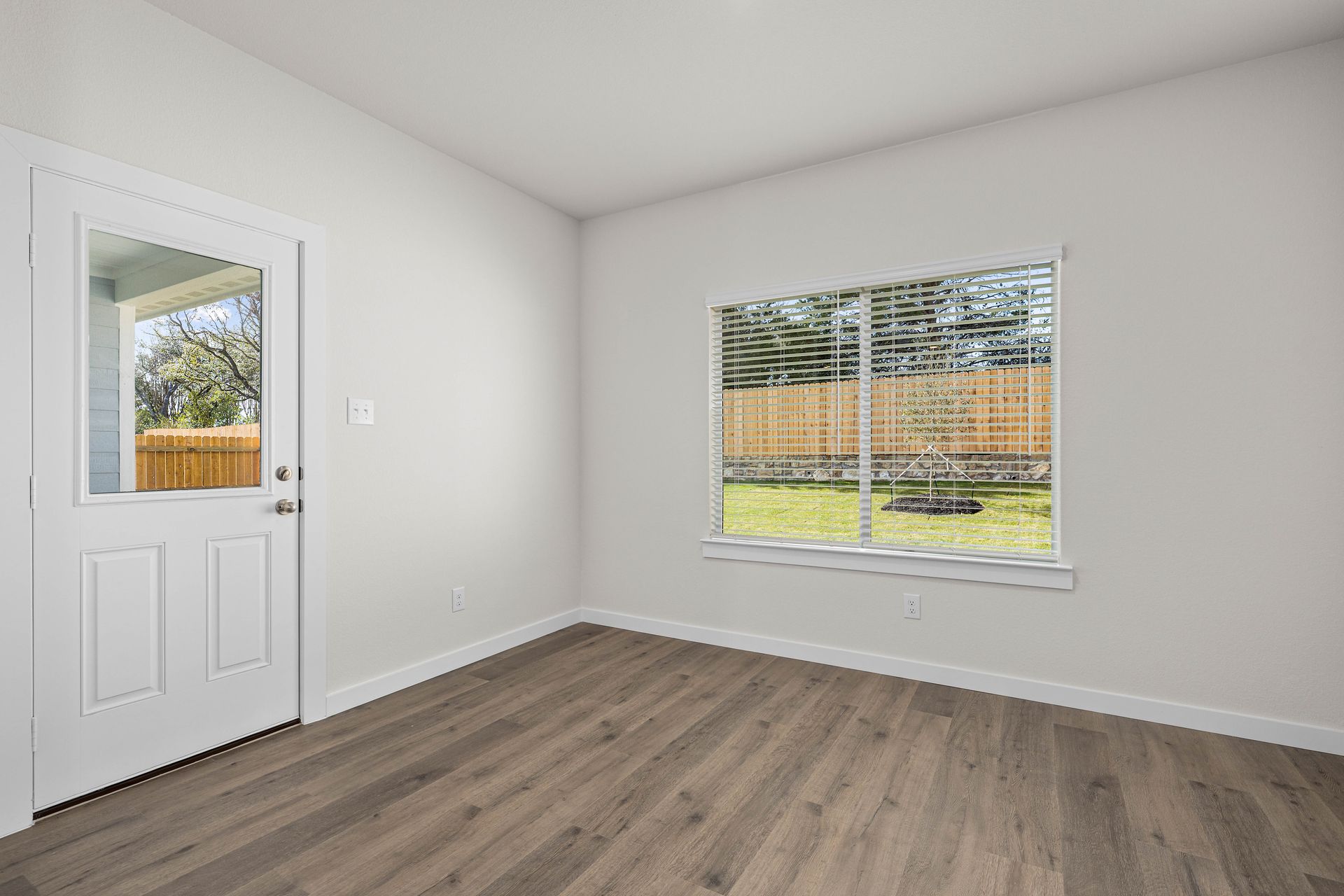 The dining room has large windows that let in great, natural light.
