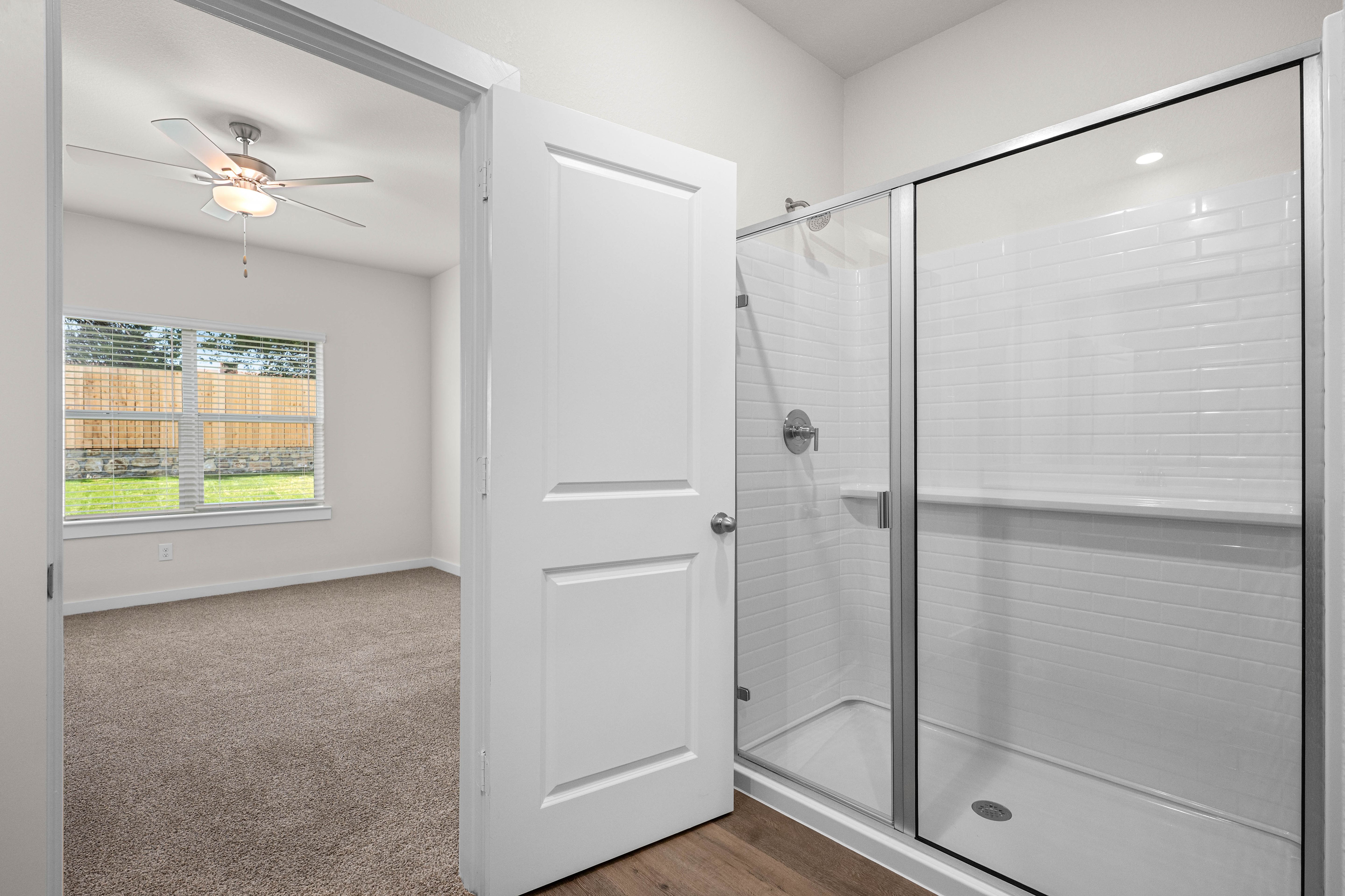 The master bathroom has a glass, walk-in shower.