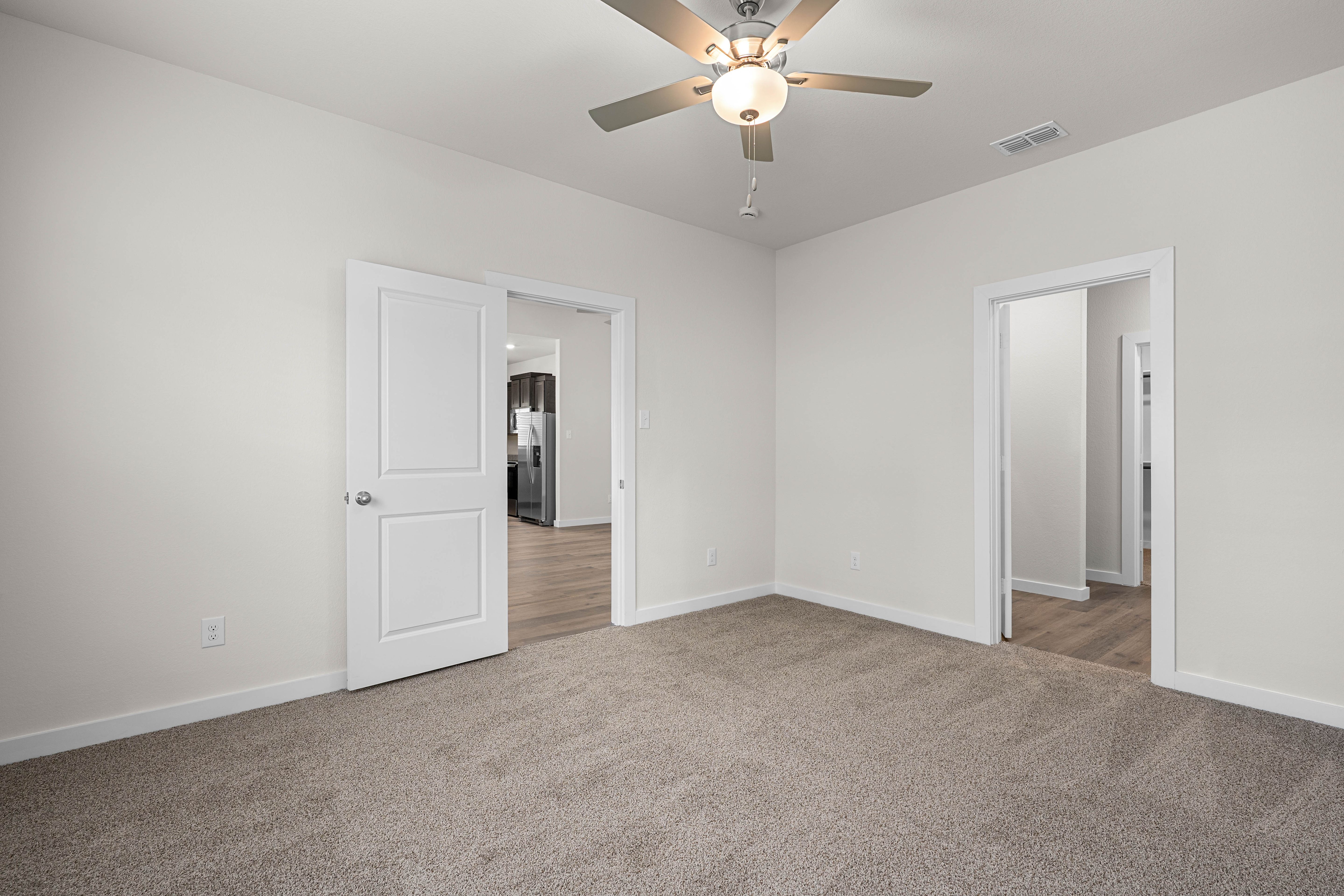 The master suite has a large bedroom, ensuite bathroom and a walk-in closet.