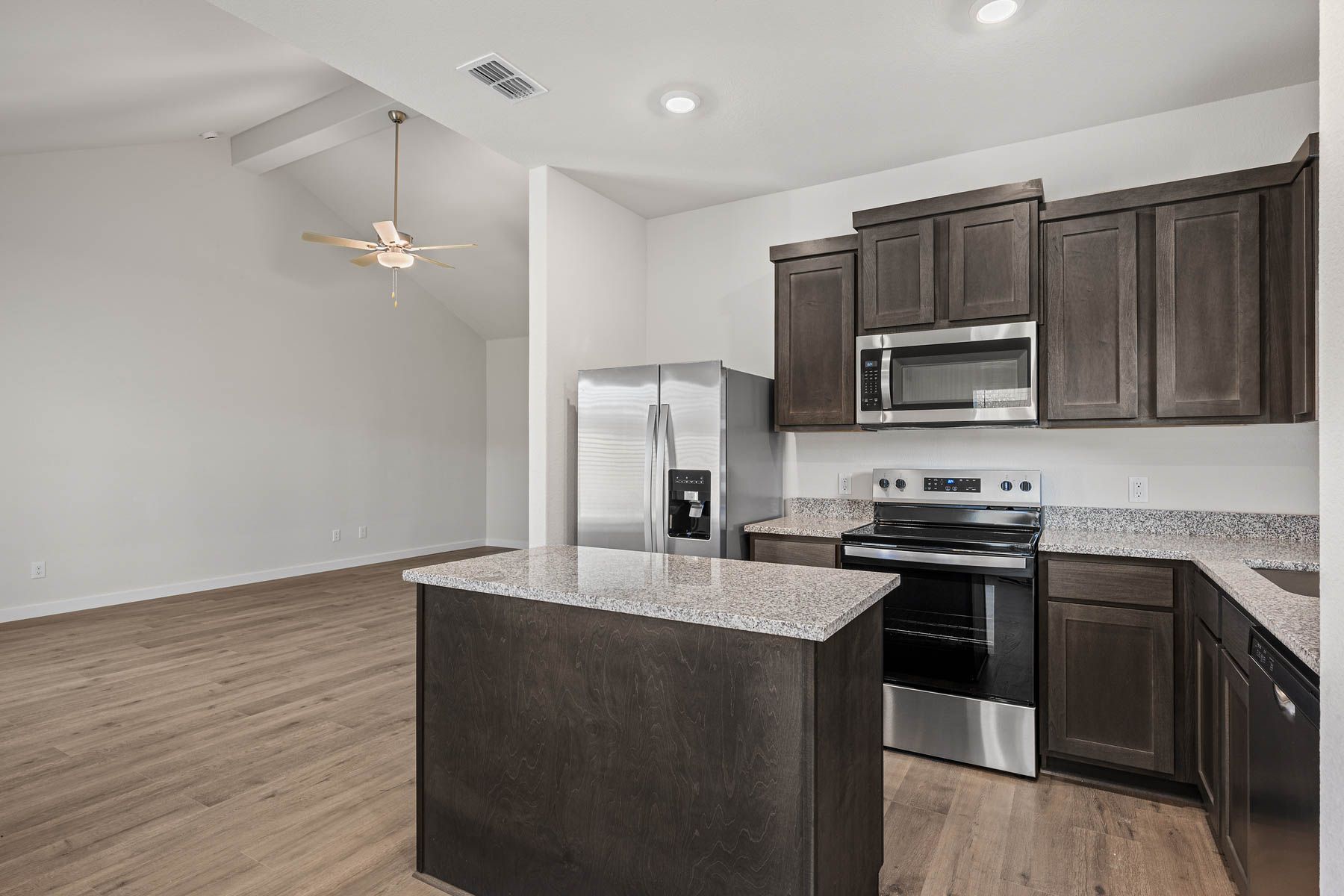 The kitchen has beautiful wood cabinetry.