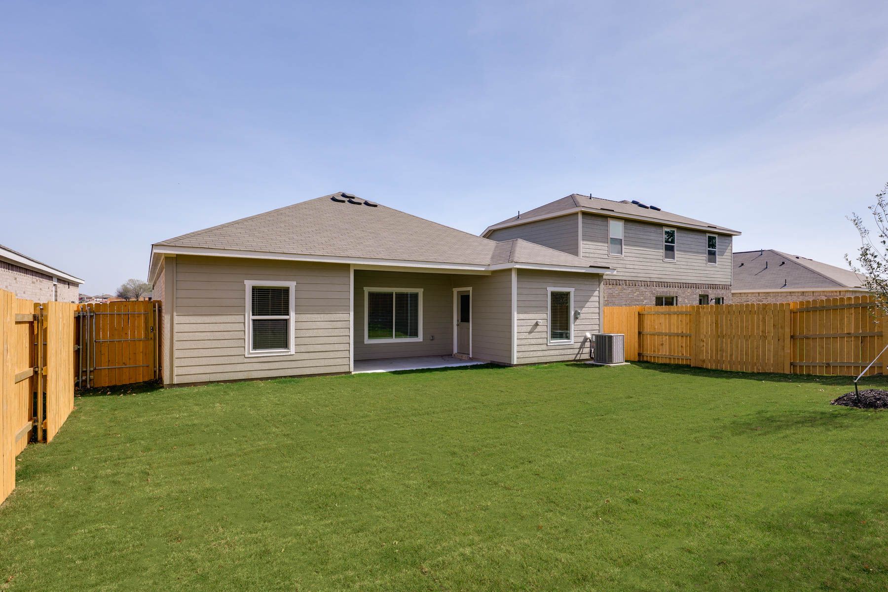 The back yard is fully fenced in.