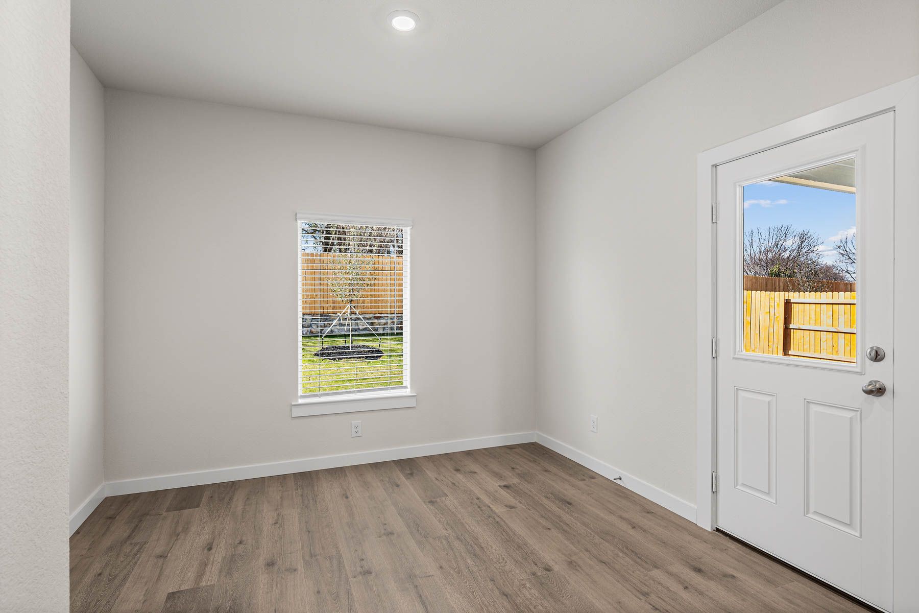 The dining room has large windows that let in great, natural light.