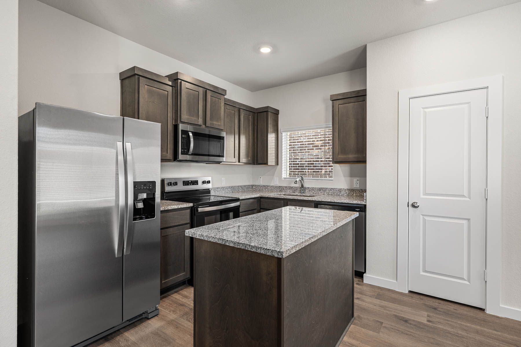The kitchen has stainless-steel, energy-efficient appliances.