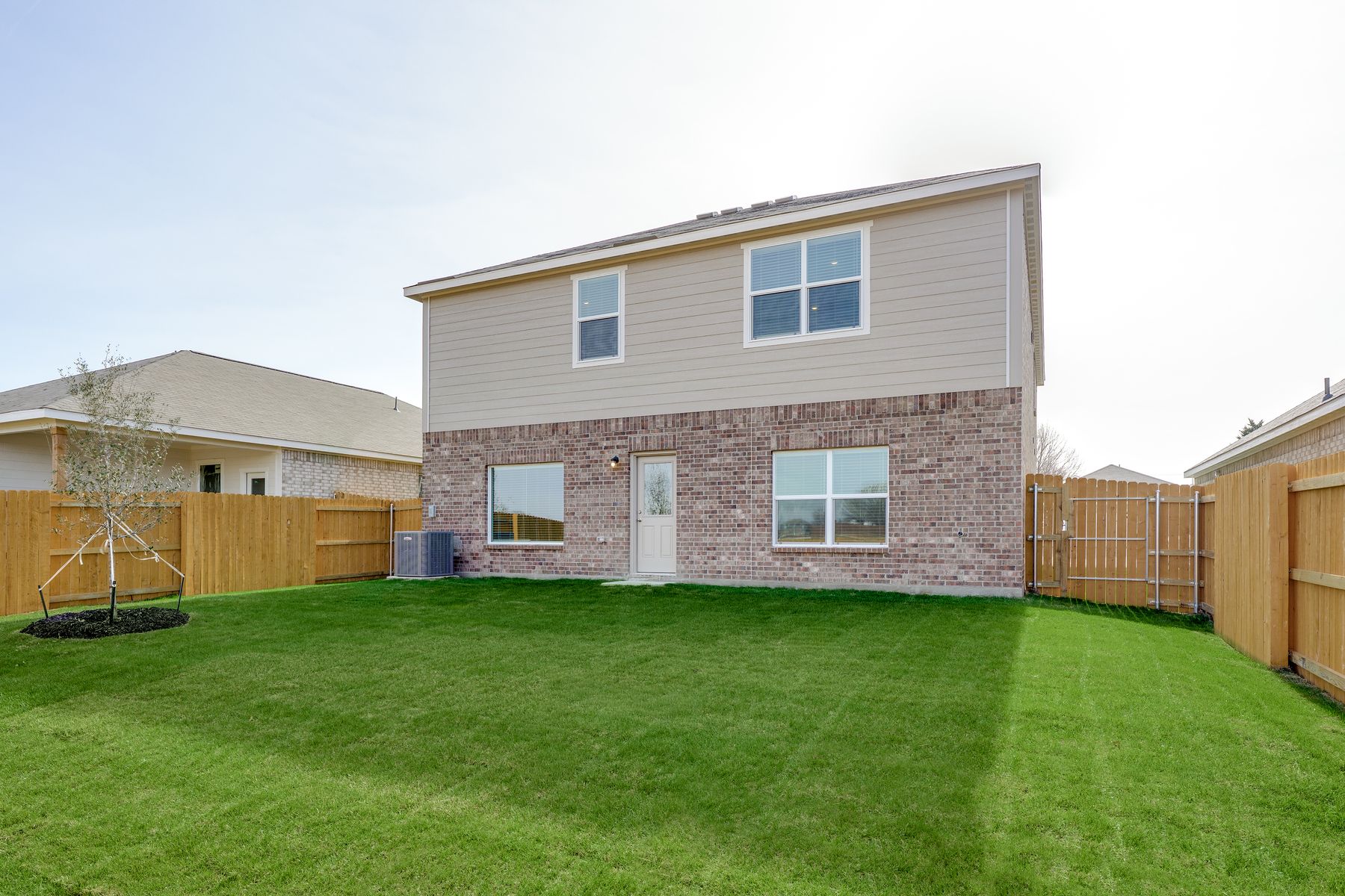 The back yard is fully fenced in.