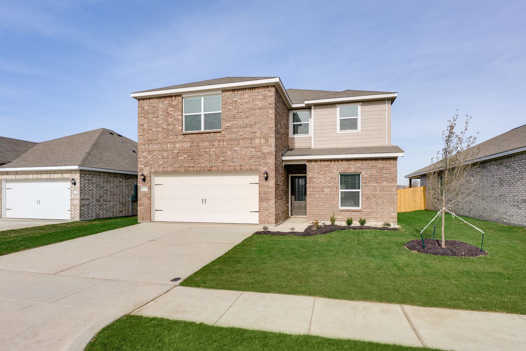 The Cottonwood has an attached two-car garage.