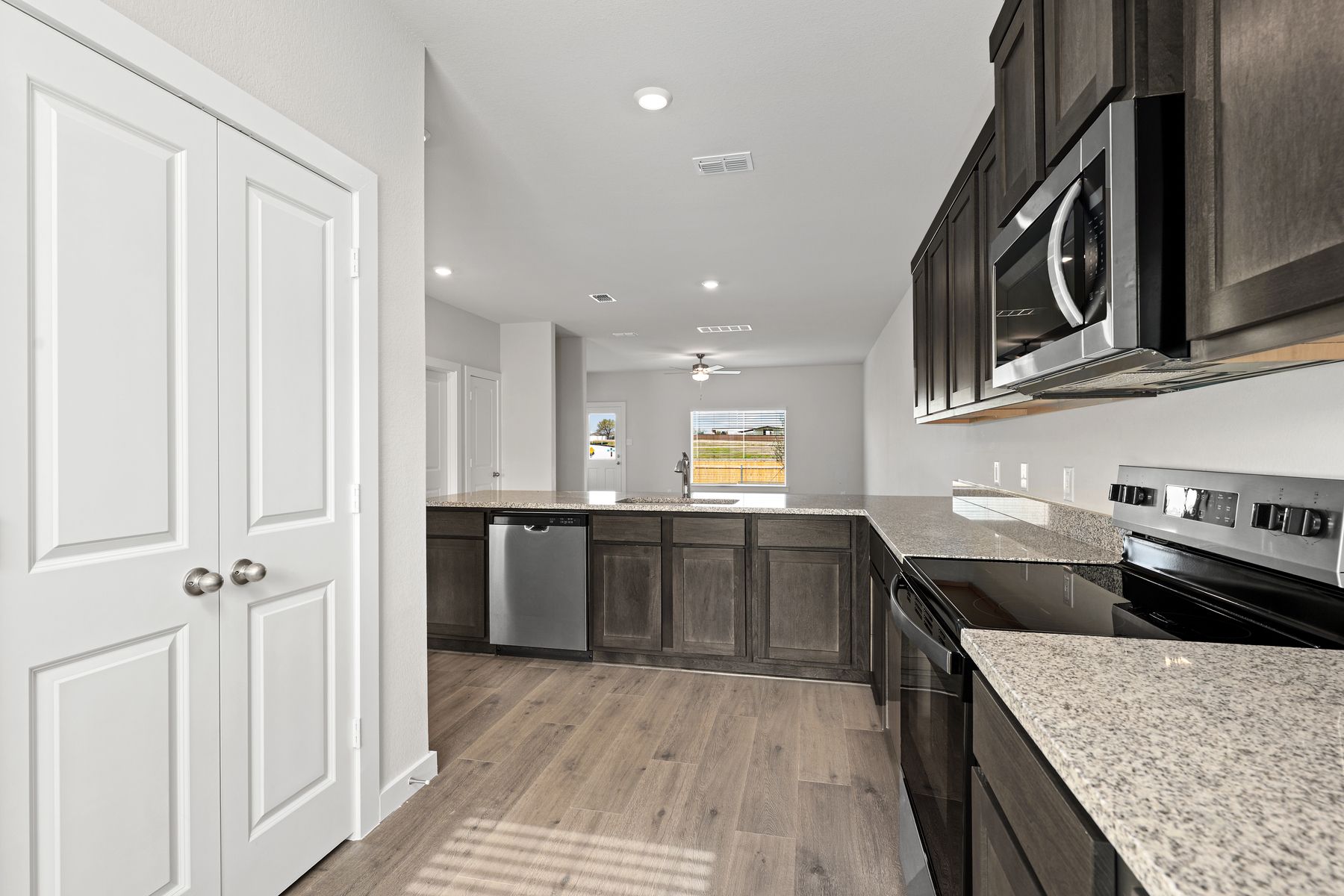 The kitchen has sprawling granite countertops.