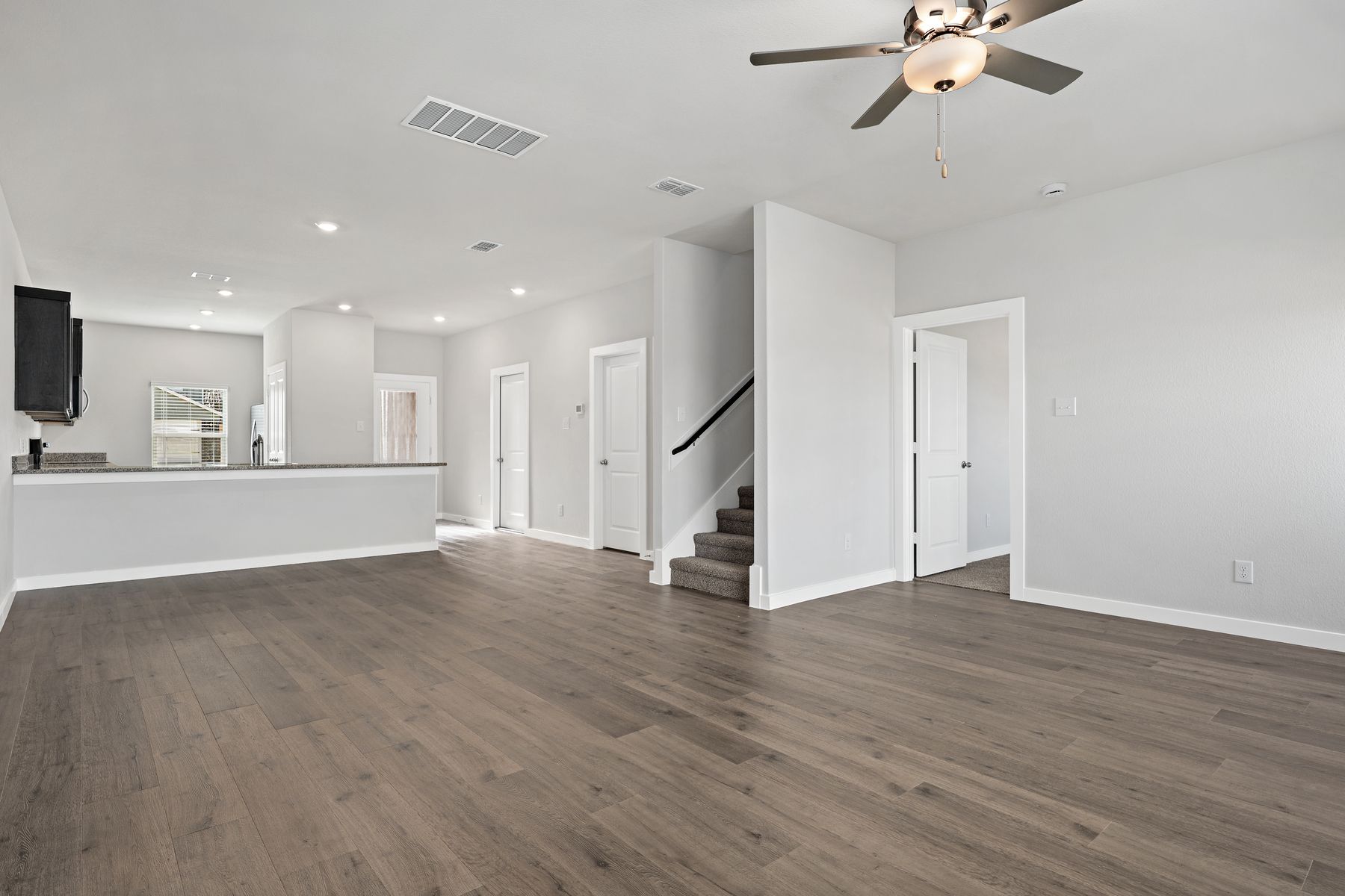 The Cottonwood has an open layout that connects the kitchen, dining room, and family room.