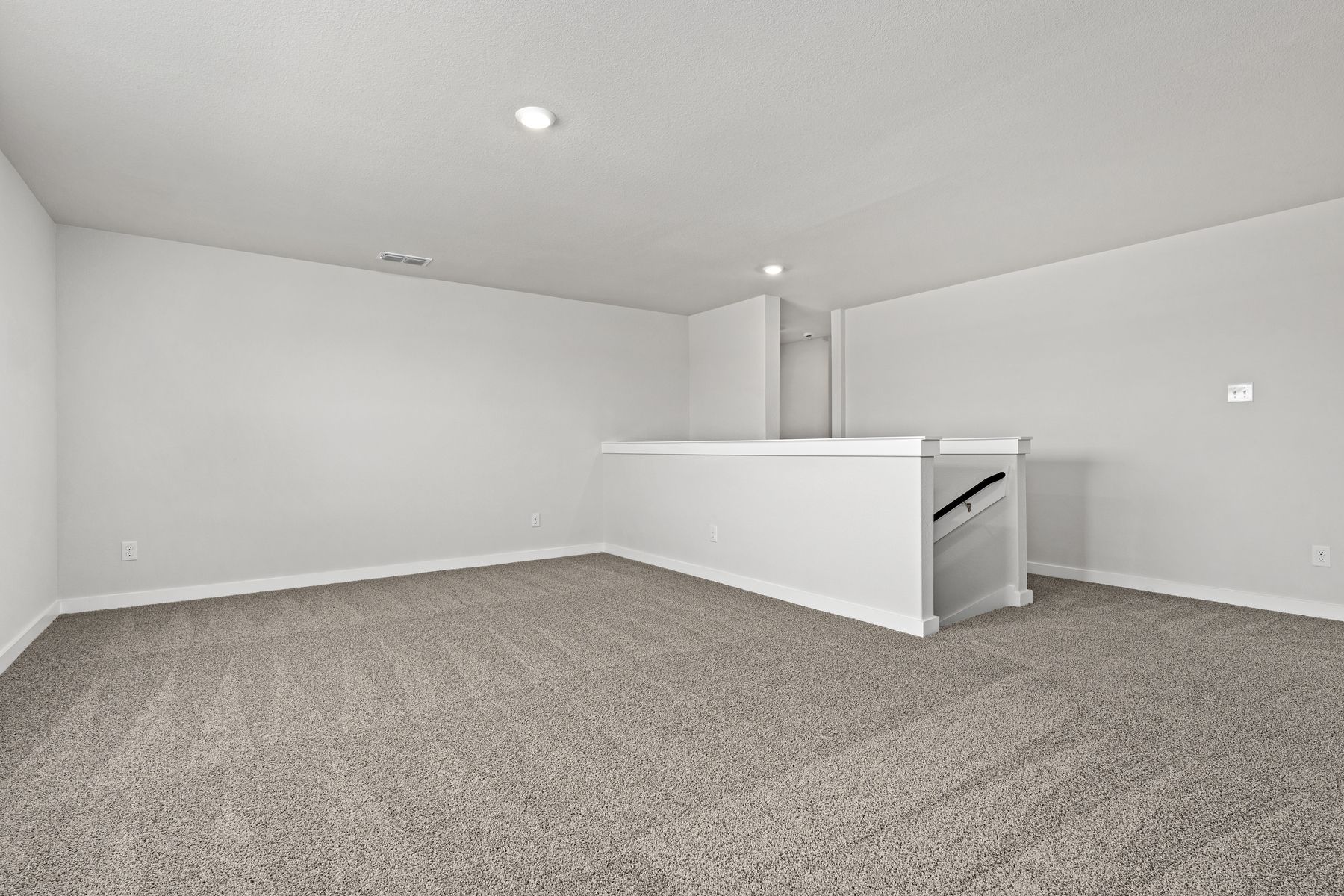 Upstairs, the gameroom loft is an extended, versatile living space.