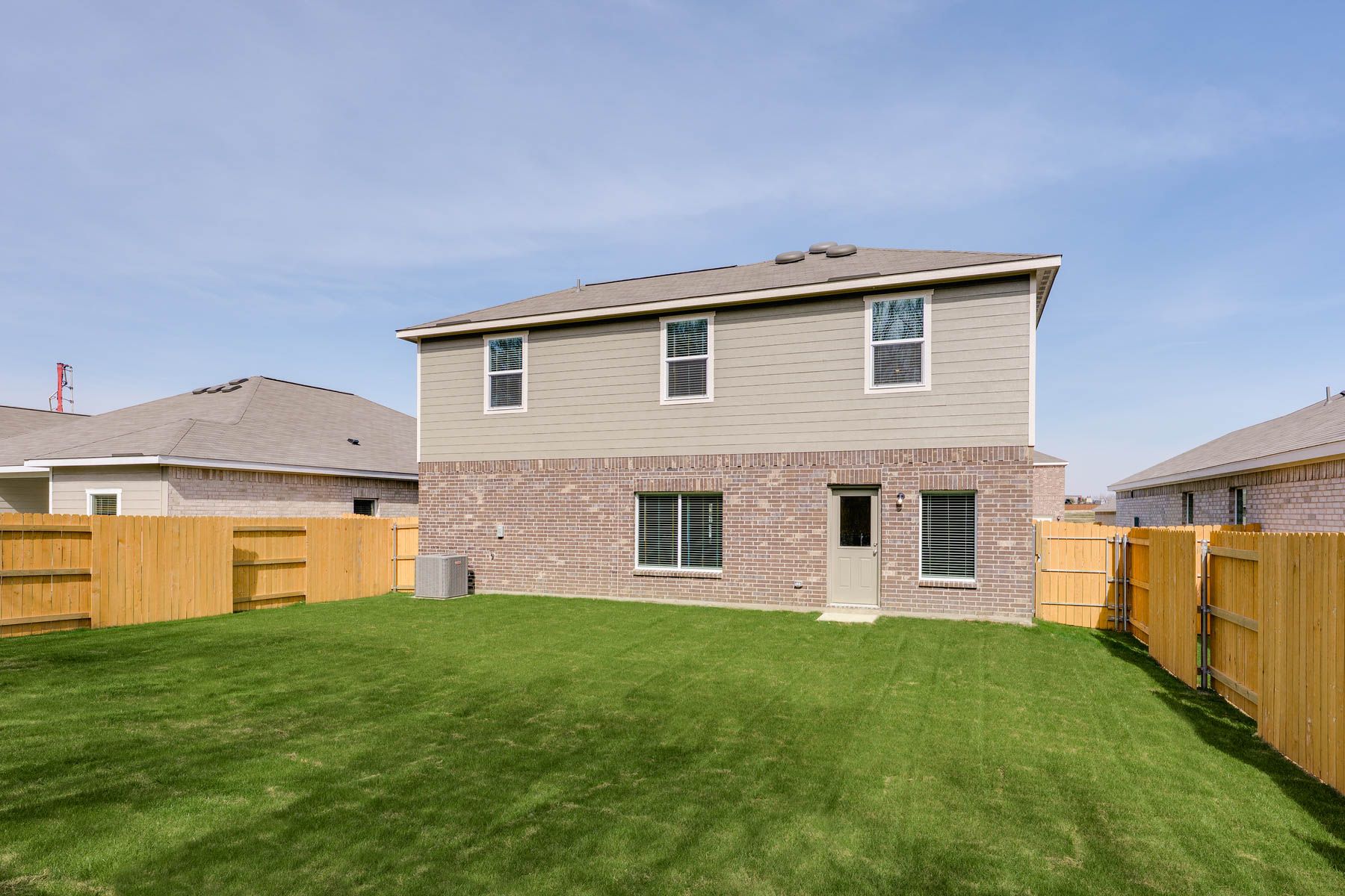 The back yard is fully fenced in.