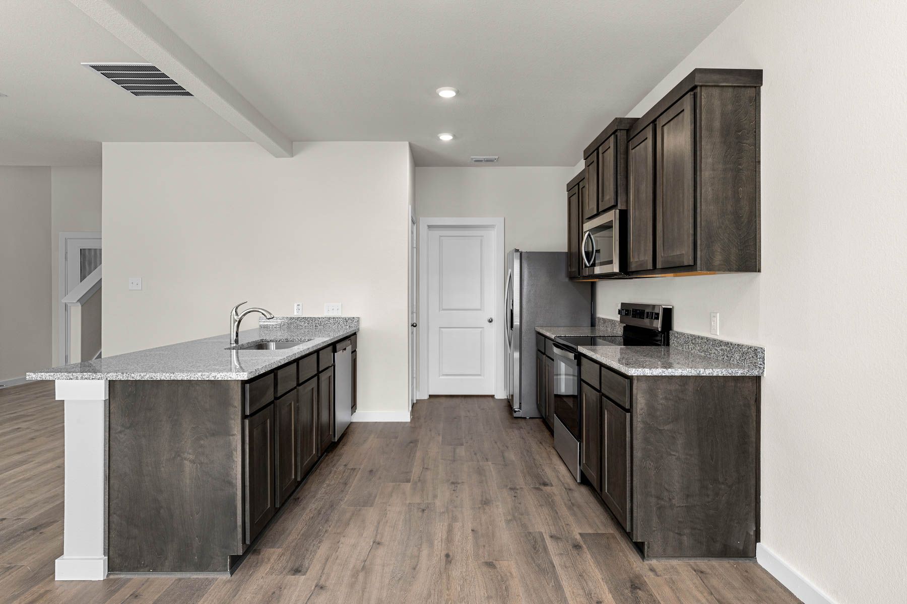 The kitchen has stainless-steel, energy-efficient appliances.