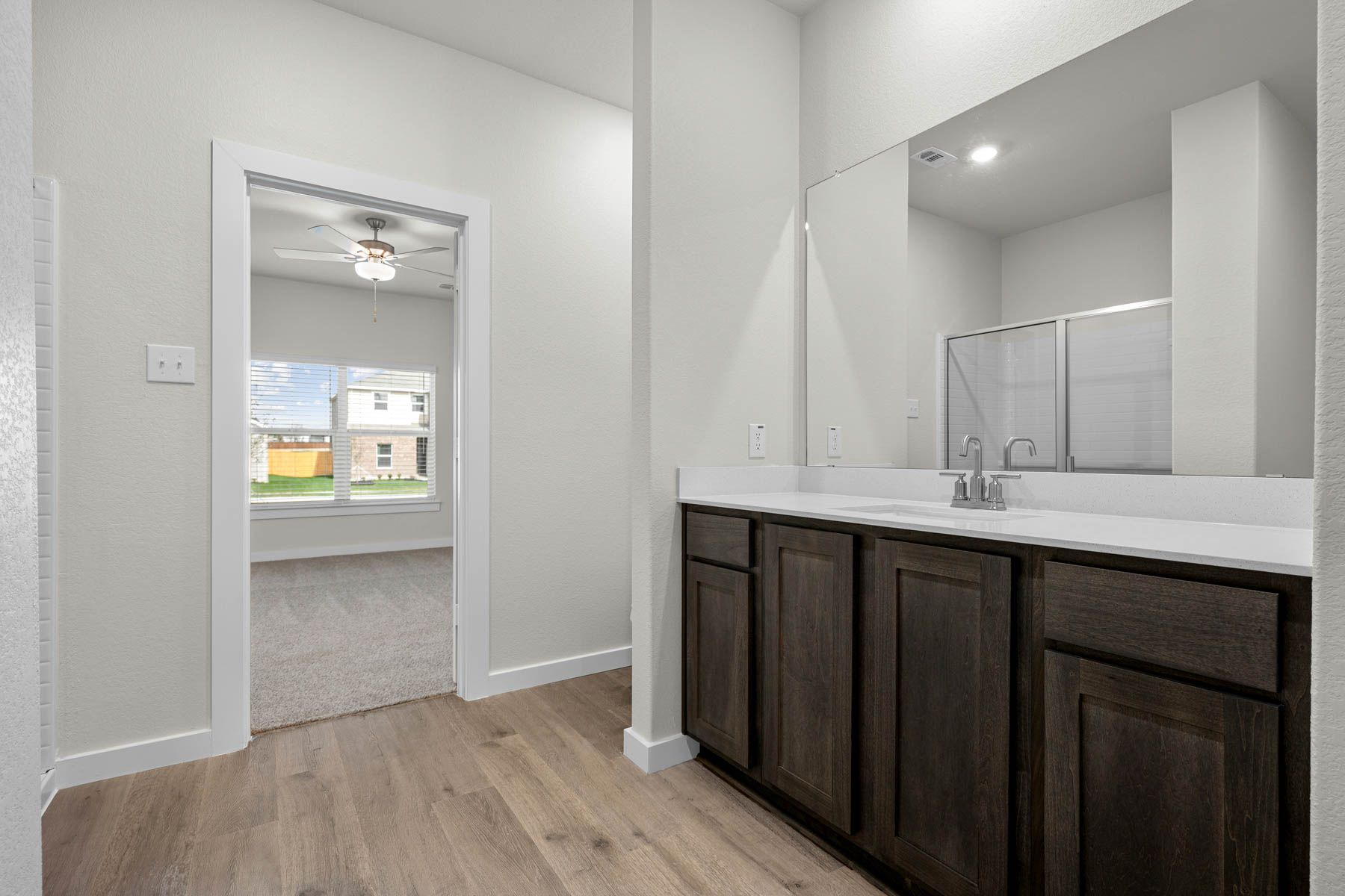 The master bathroom has a sprawling vanity.