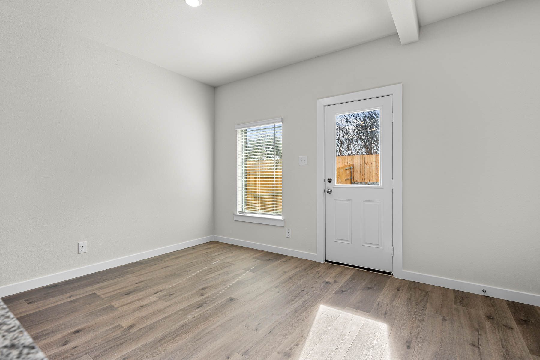 The dining room has large windows that let in great, natural light.